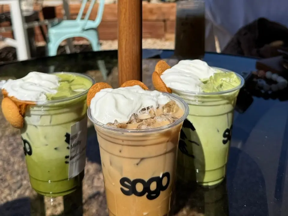 two matchas and coffee drink on table