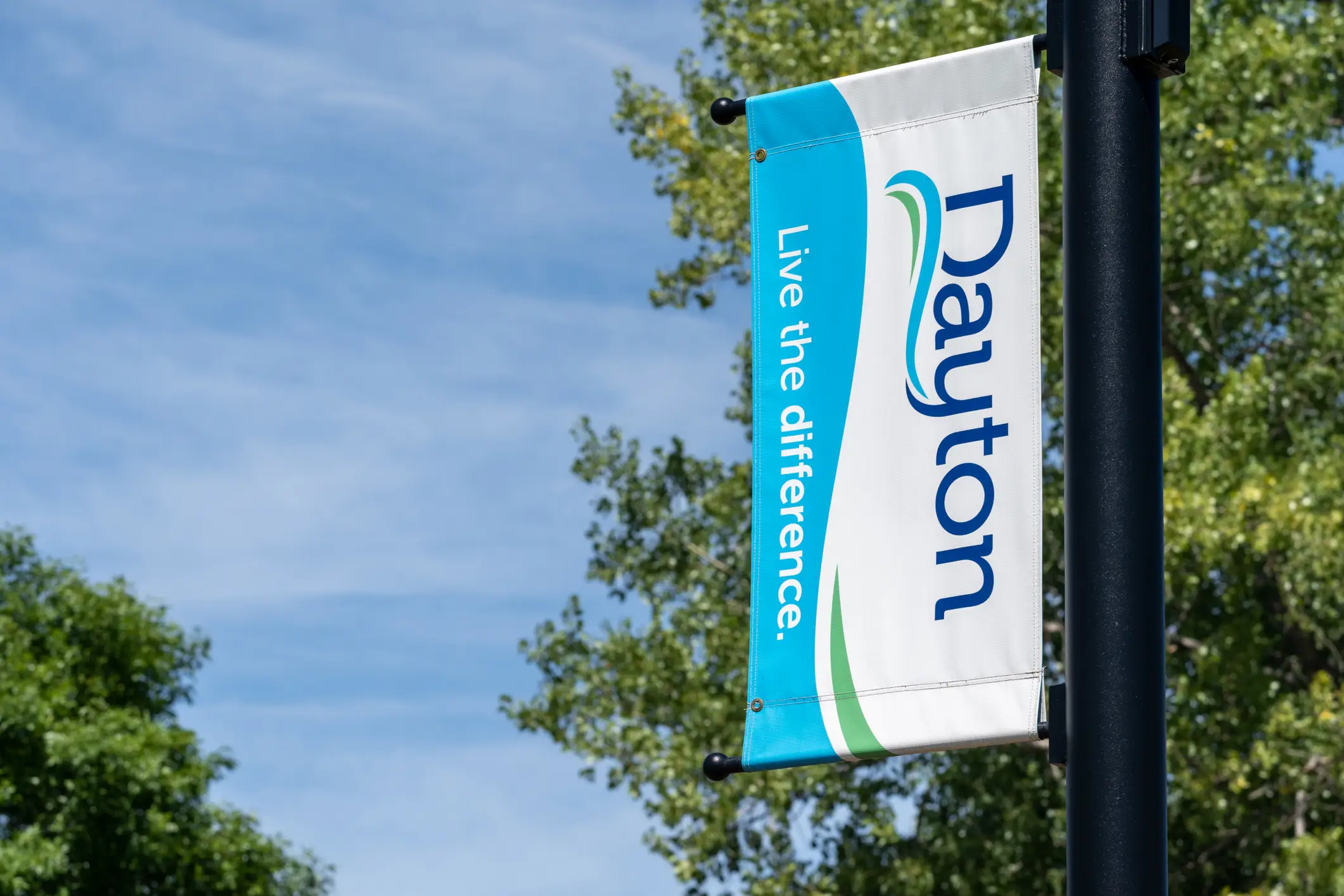 A Dayton street banner reading