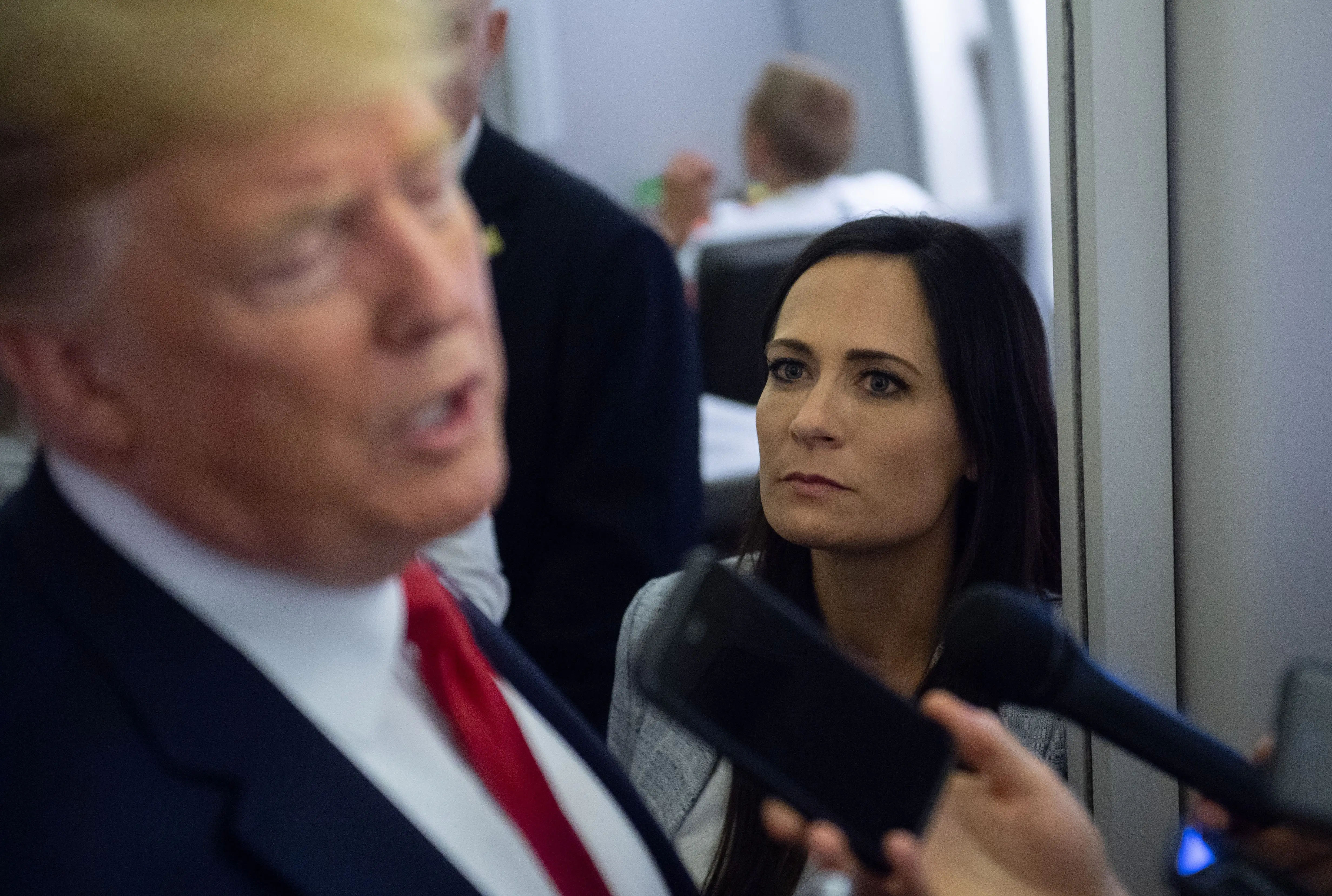 Stephanie Grisham with Donald Trump aboard Air Force One in 2019.