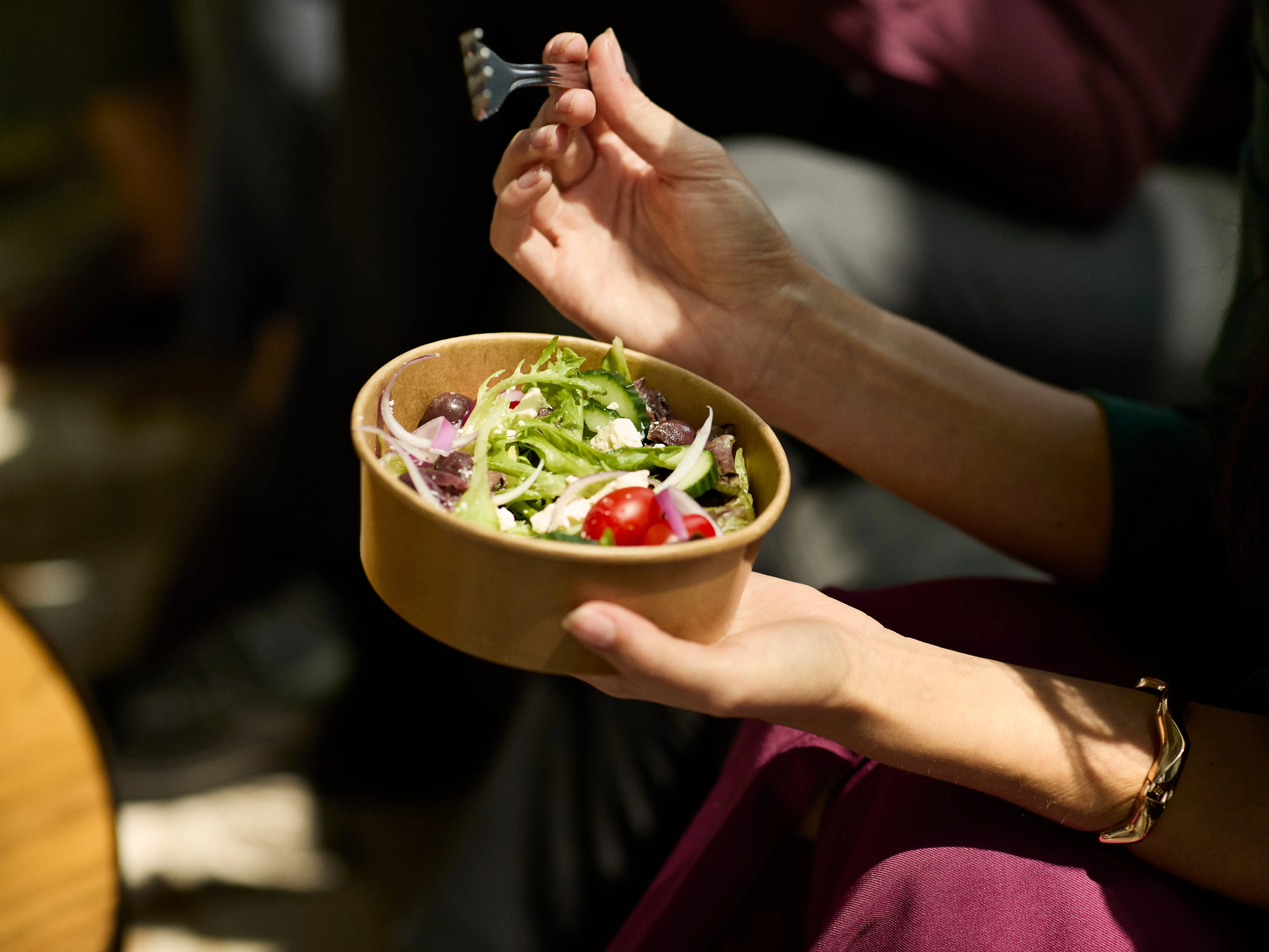 Woman eating salad