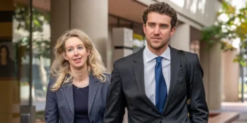 Elizabeth Holmes’ partner, Billy Evans, is the real villain in ‘You Can See Everything.’ Here’s what to know about him.