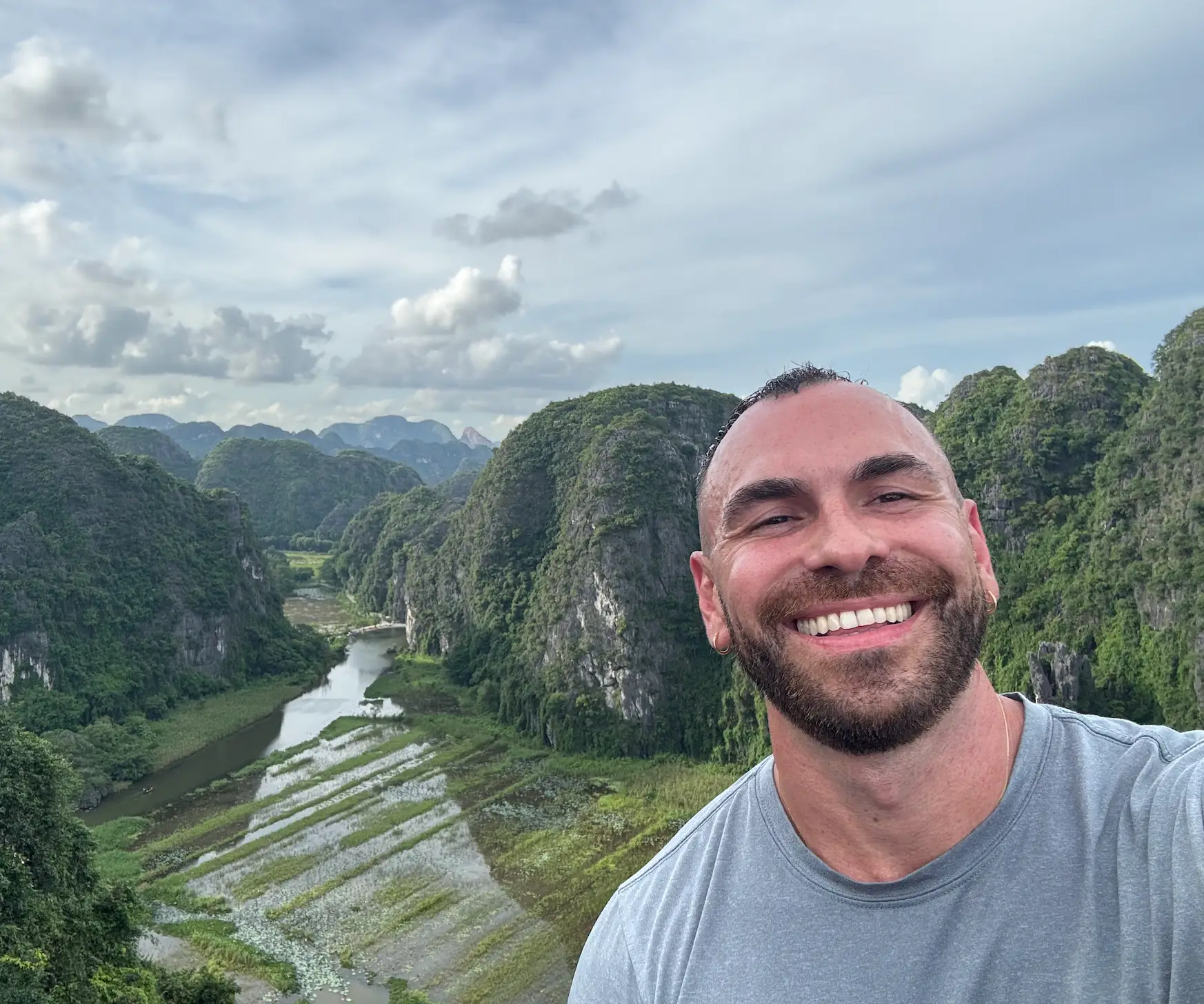 a man takes a selfie on a cliff