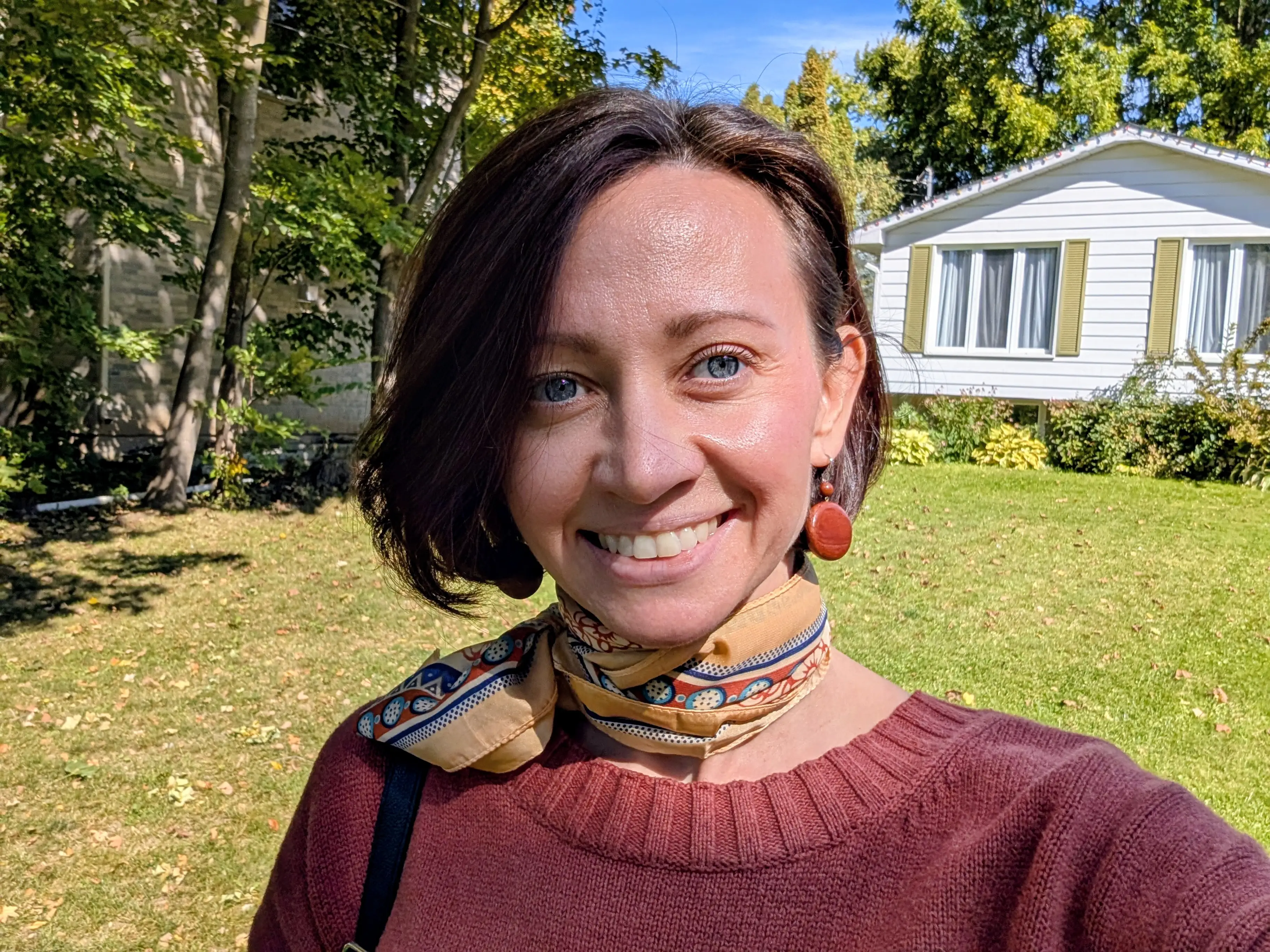 Woman smiling outside of home