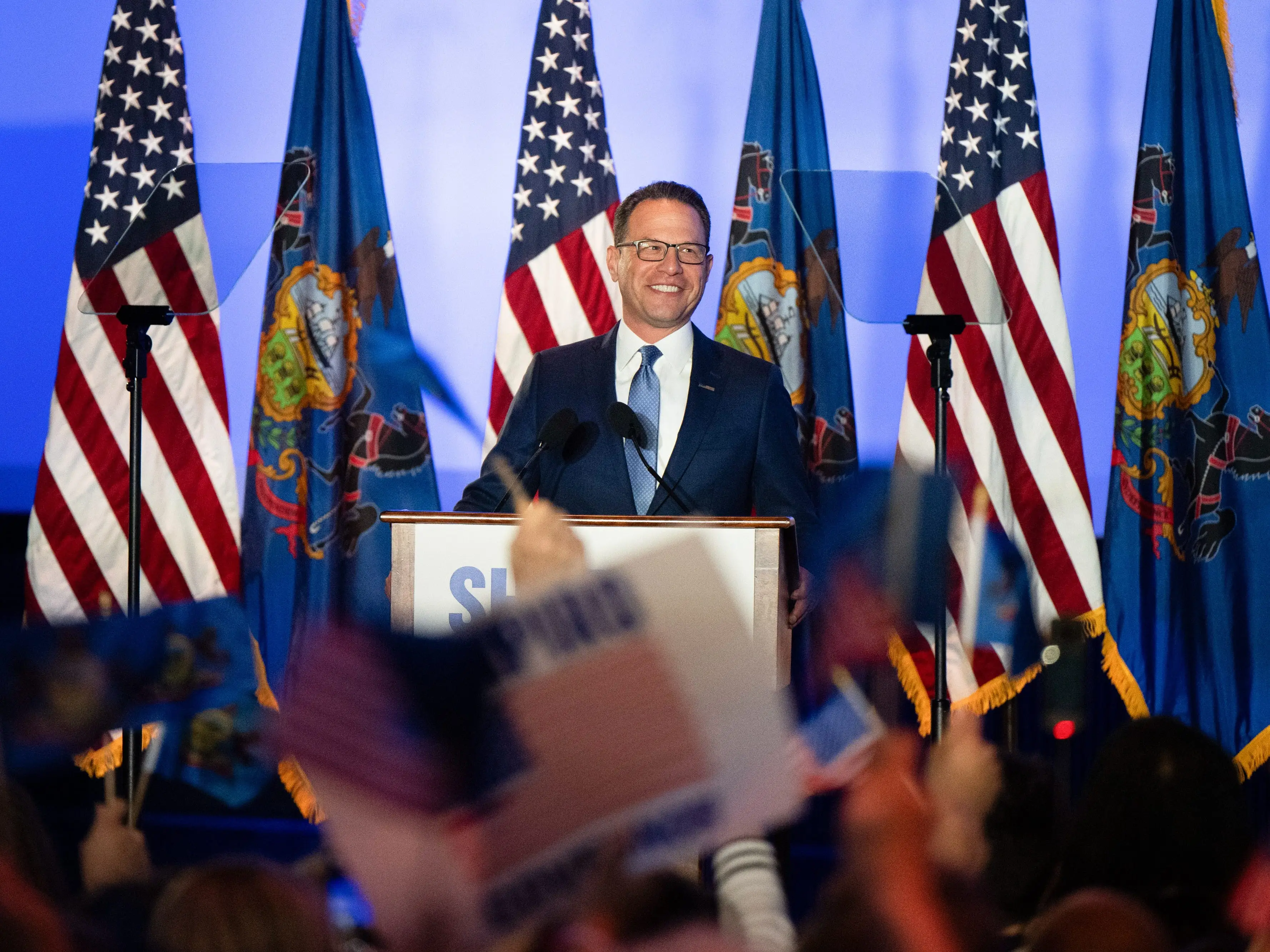 Josh Shapiro speaks at a podium