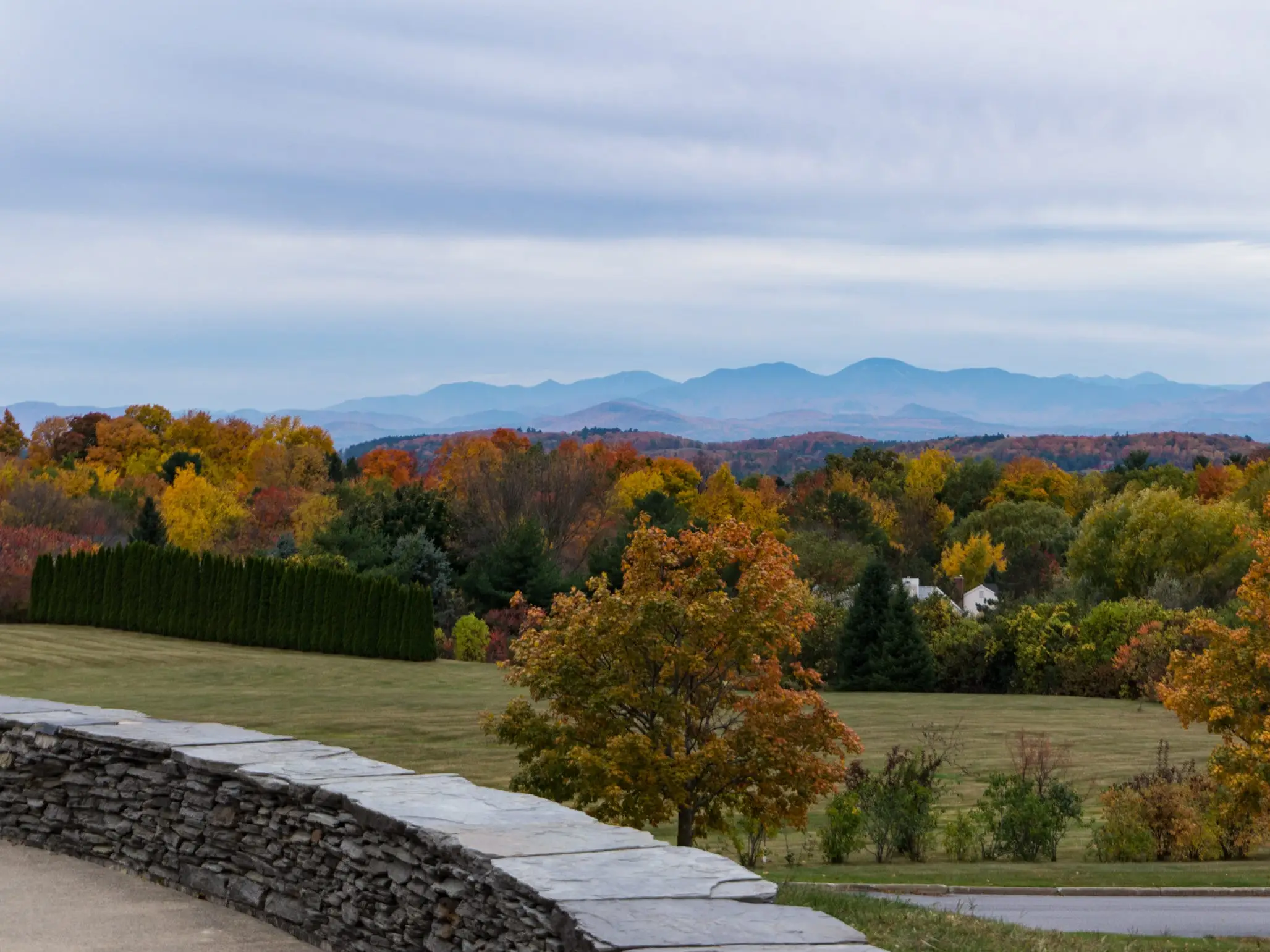 view of fall foliage and Adirondack Mountains in New York from Overlook Park in South Burlington, Vermont