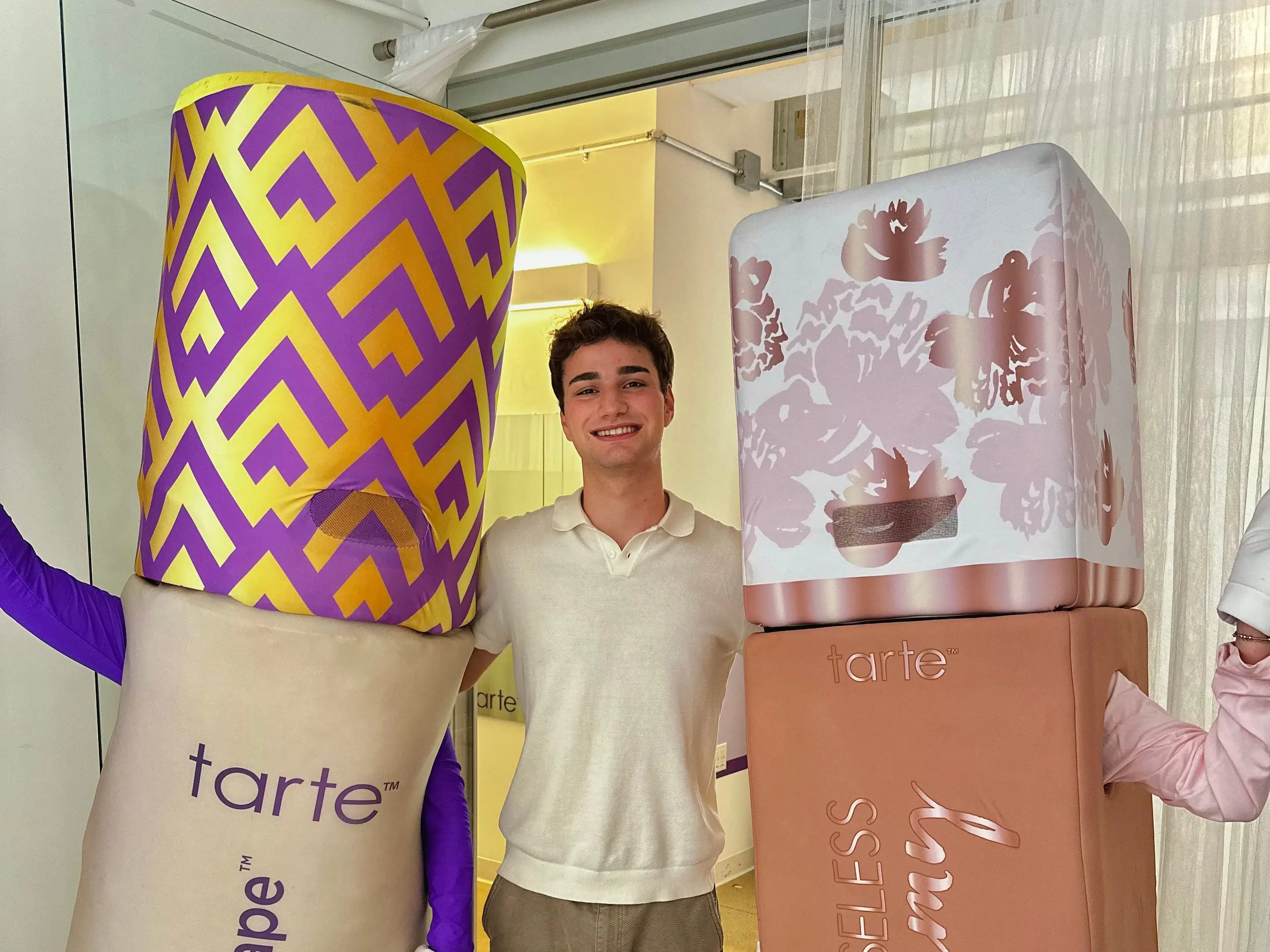 a man poses with two life size concealers