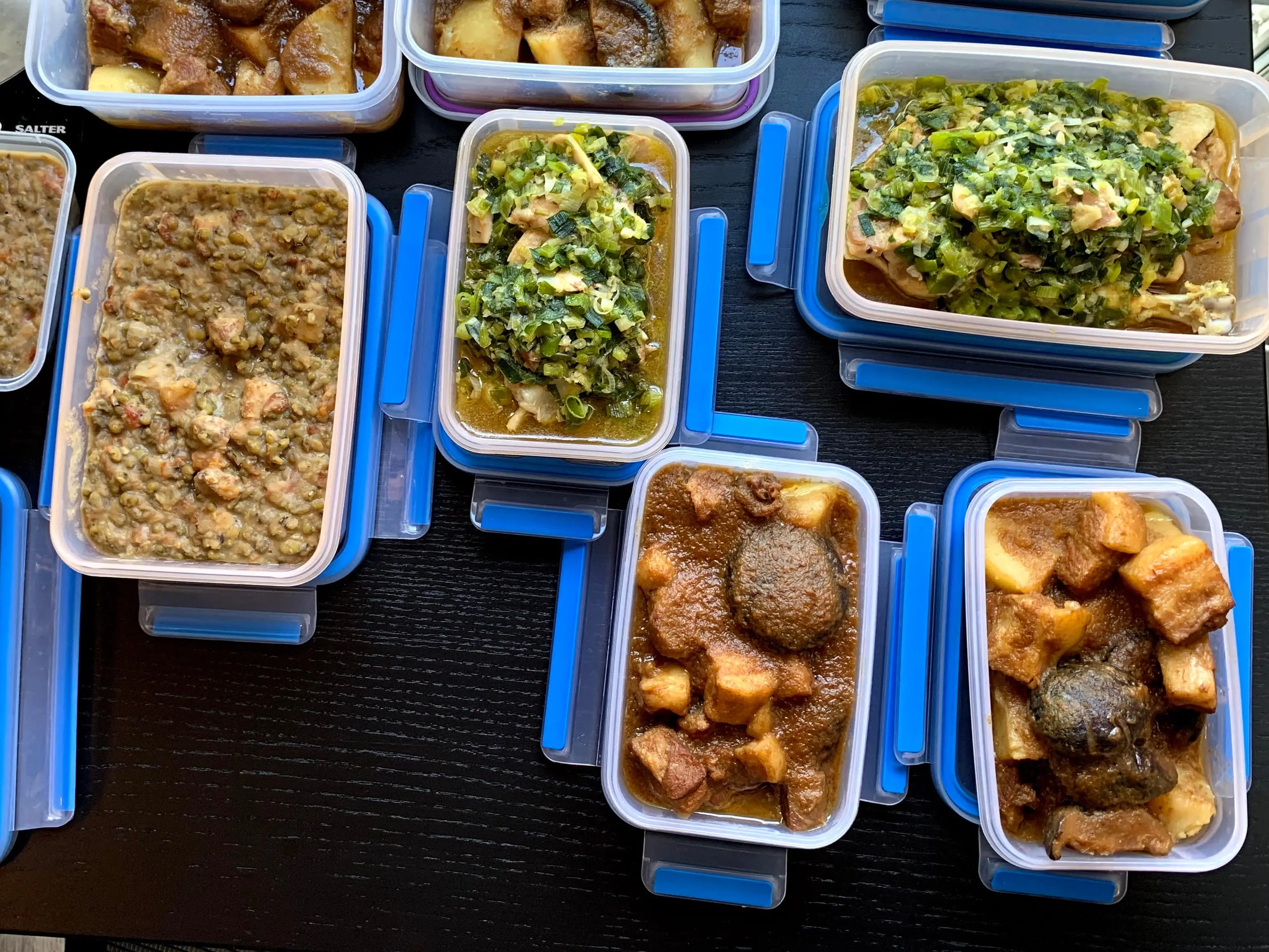 Containers of meal-prepped food on counter