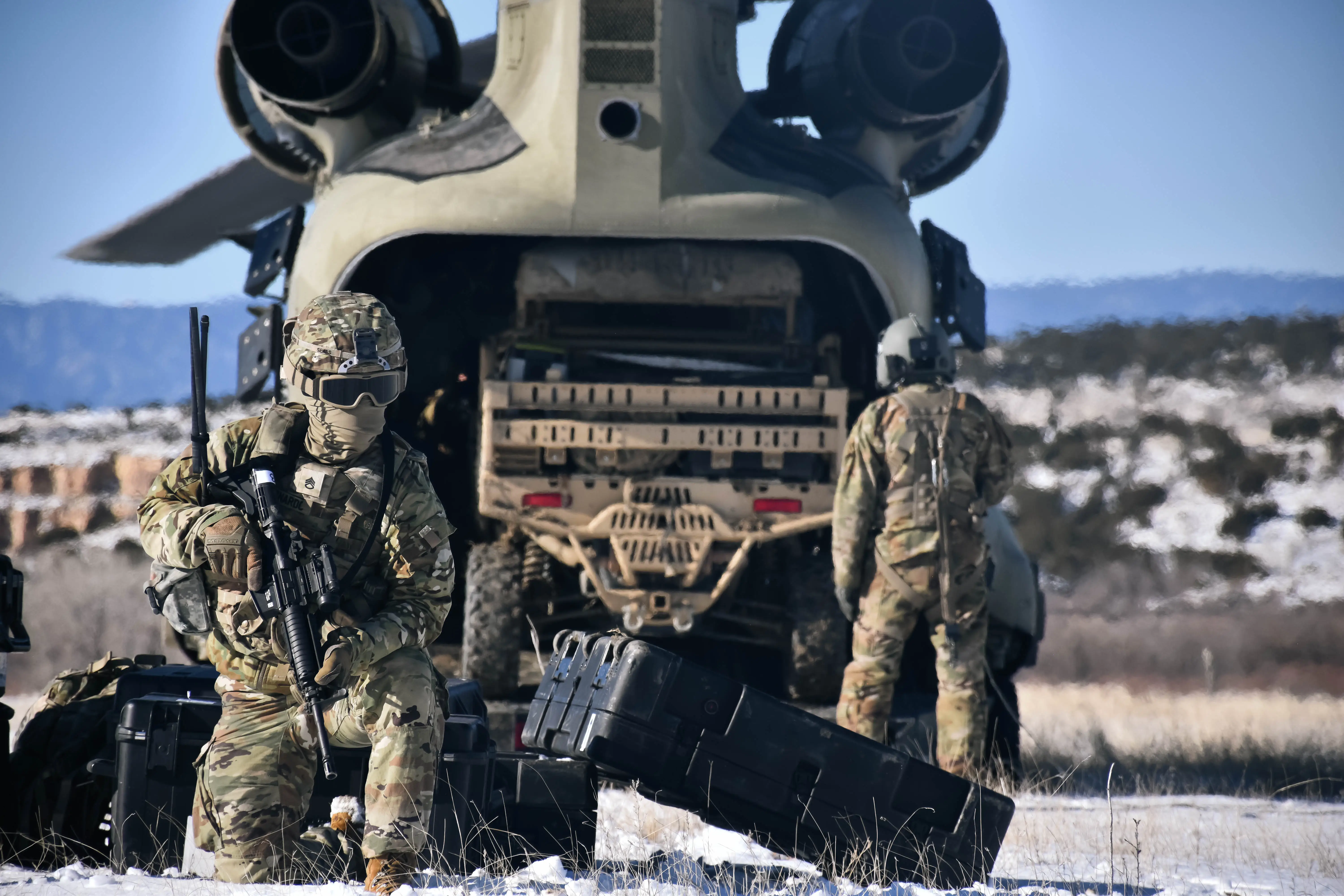 Soldiers with the Army's 1st Space Brigade unload equipment from a helicopter during training on Fort Carson, Colo. on Jan. 31, 2025.