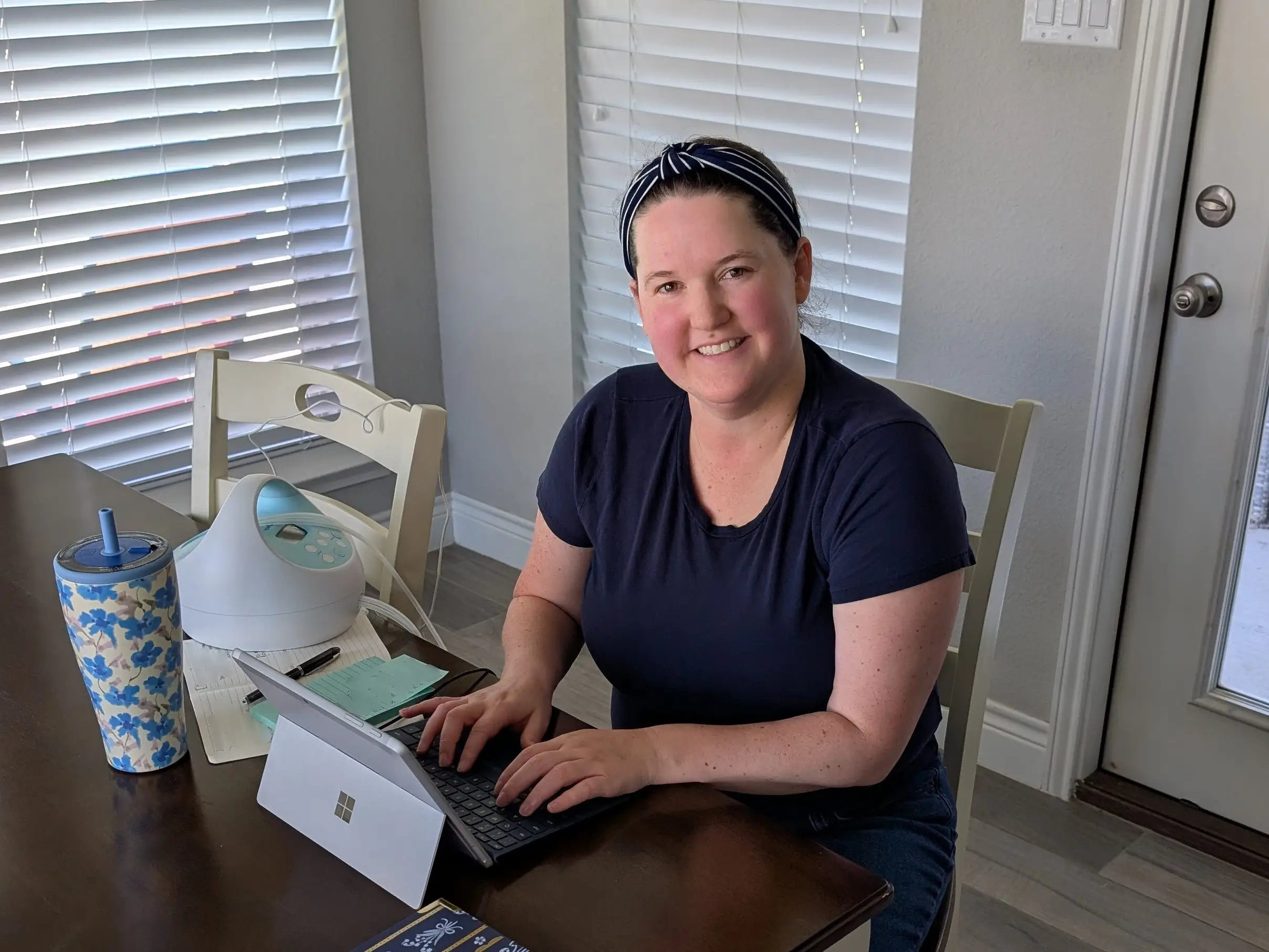 The author working at a table in her home.