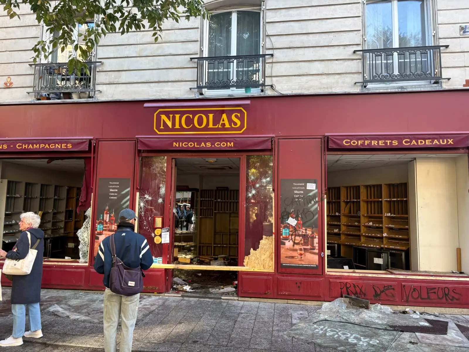 A looted wine store in Paris with smashed windows