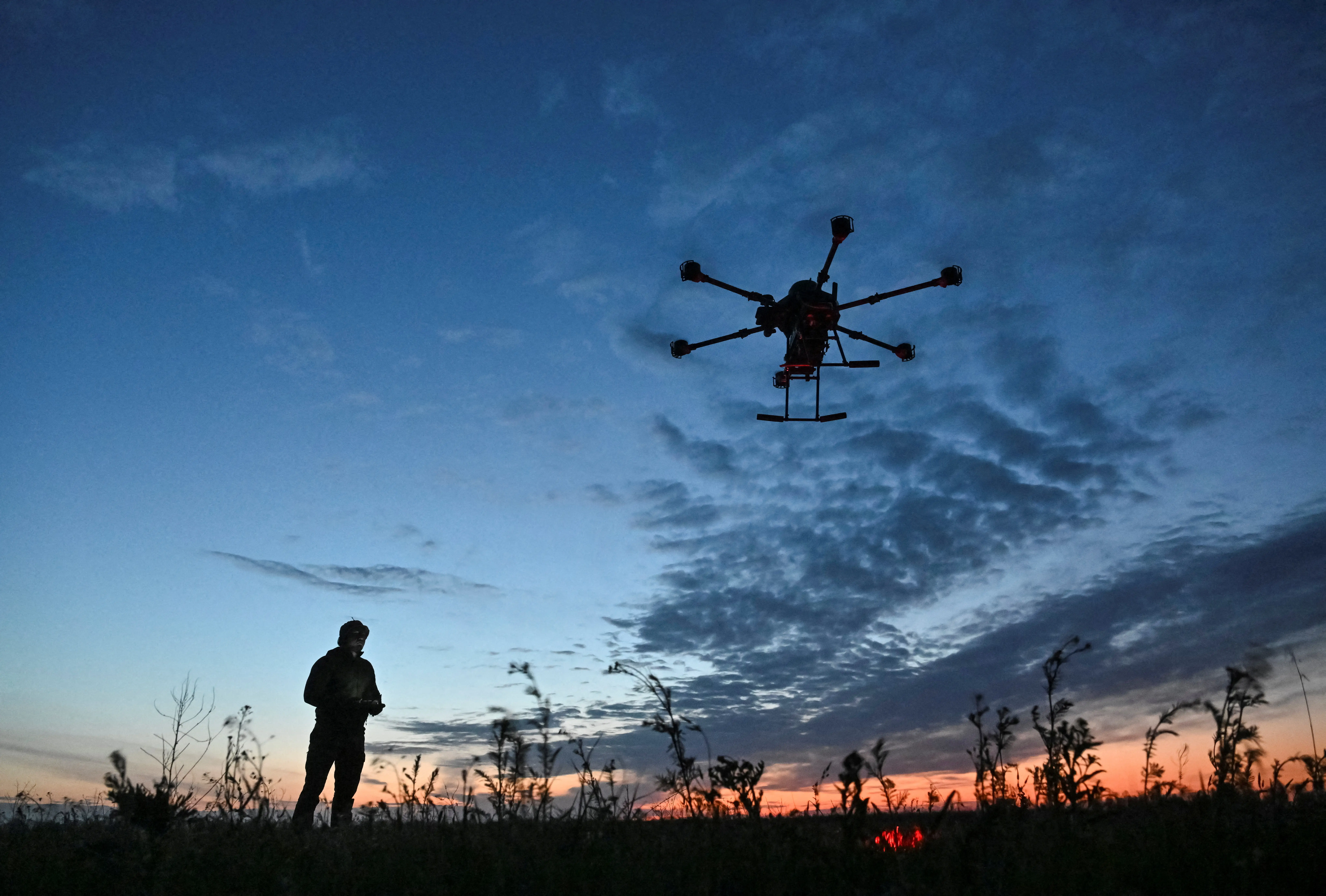 A serviceman of the Special Police Battalion launches a Vampire combat drone flying over the positions of Russian troops, amid Russia's attack on Ukraine, in the Zaporizhzhia region, Ukraine, April 29, 2025.