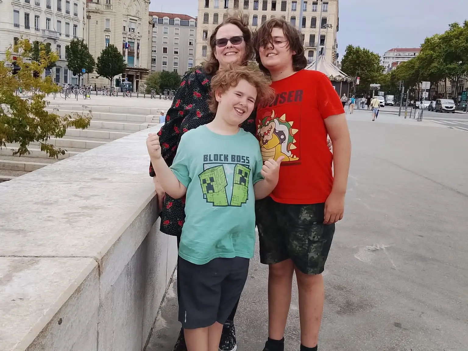 mom of two boys posing for photo