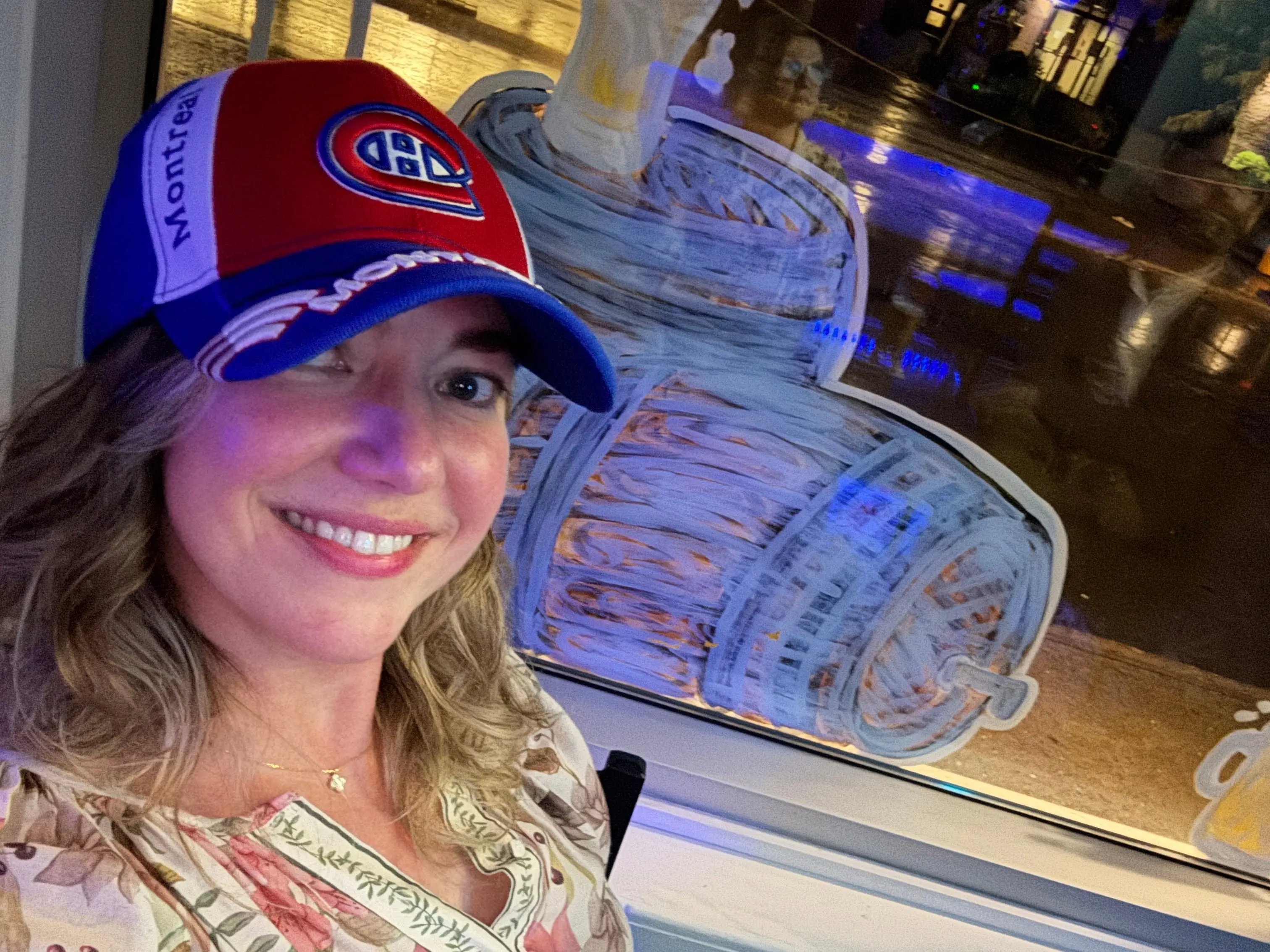 A woman watching the Stanley Cup semi-finals at a Montréal bar.