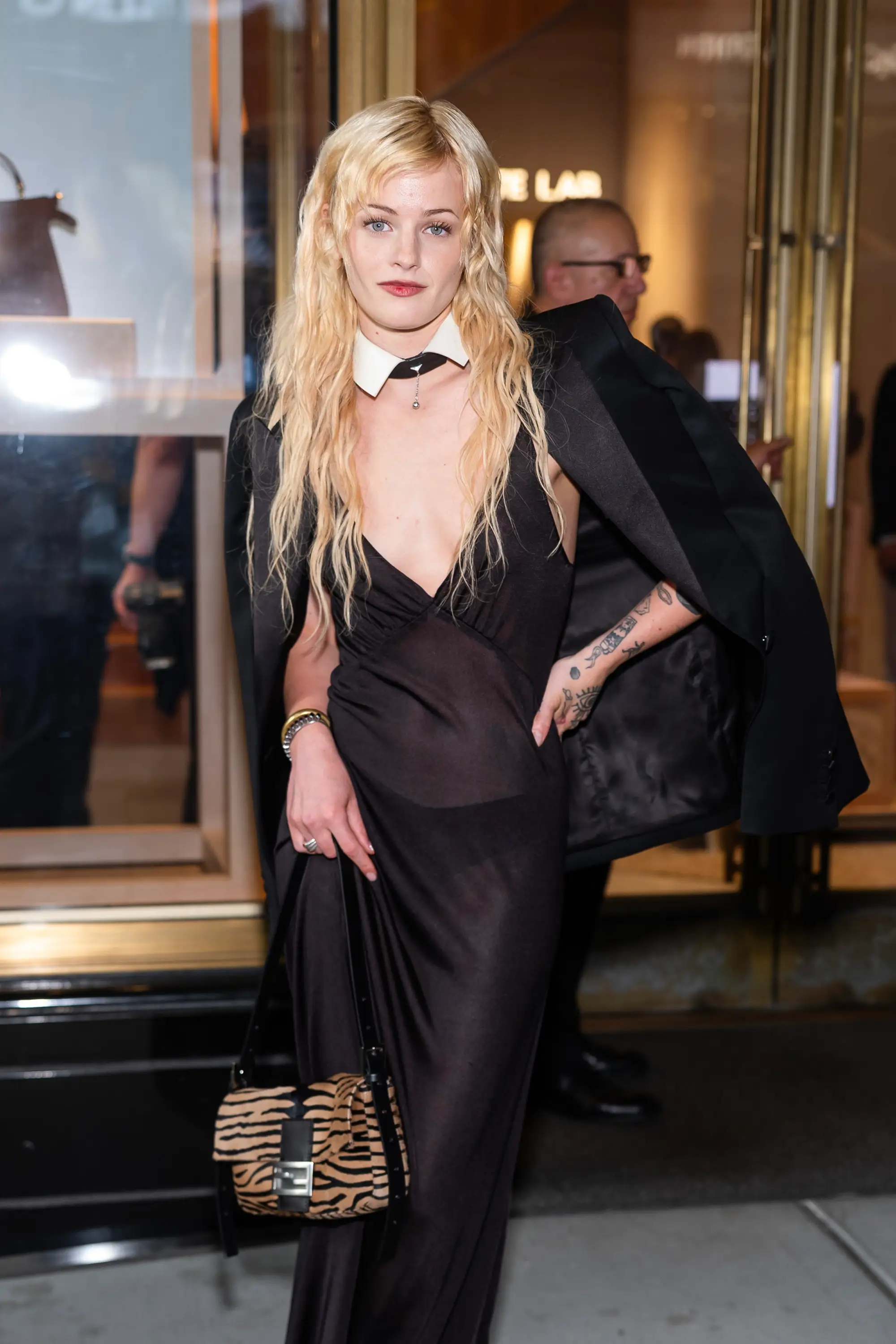 Esther McGregor stands in a black dress.