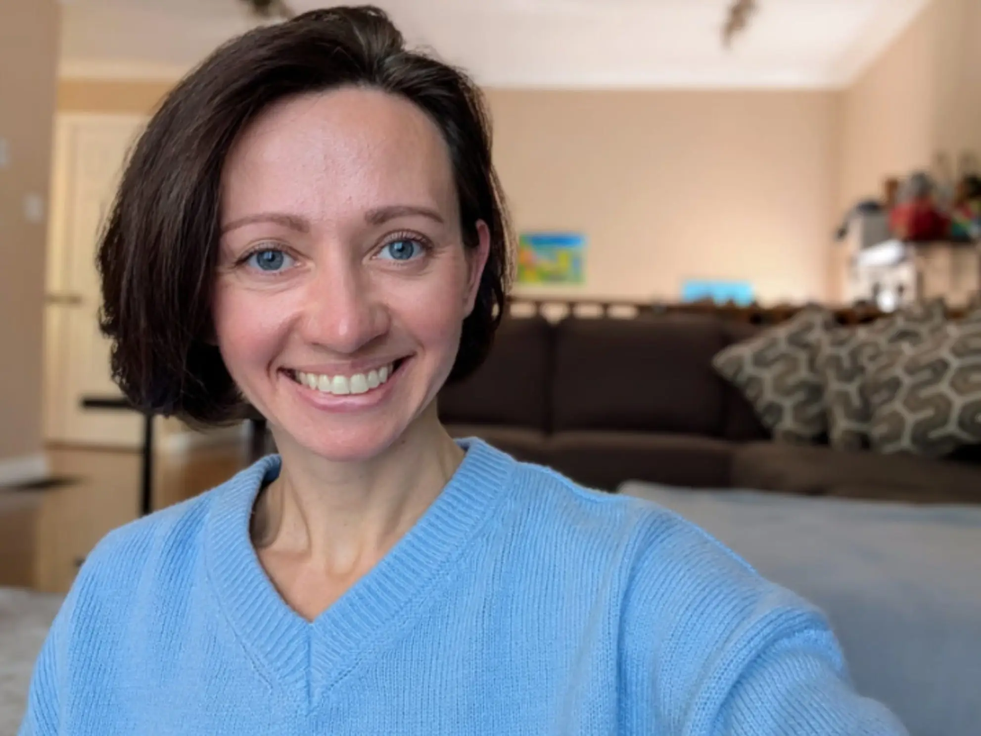 Woman smiling in living room