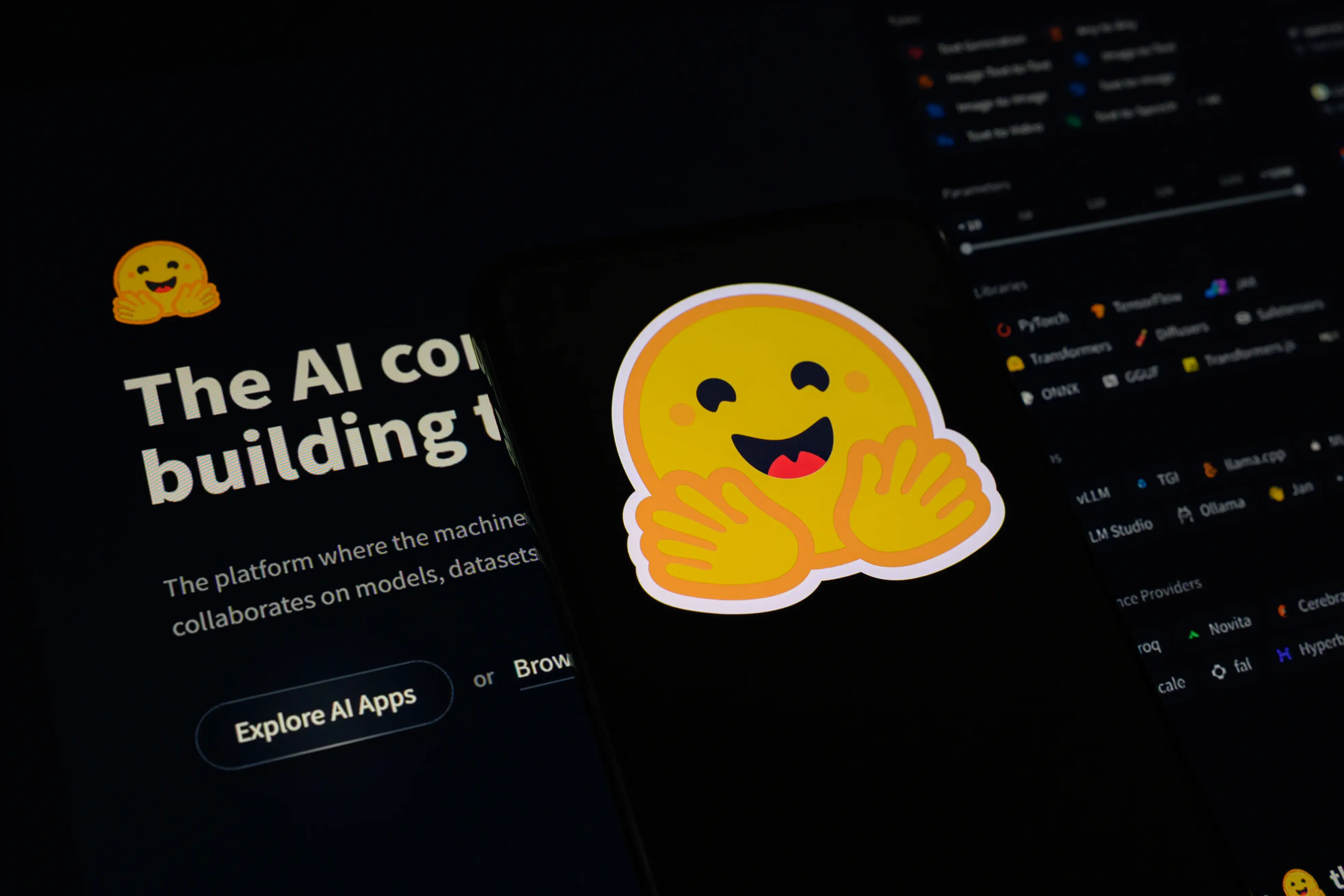 Hugging Face logo sticker over a dark website interface with AI platform text and an Explore AI Apps button.