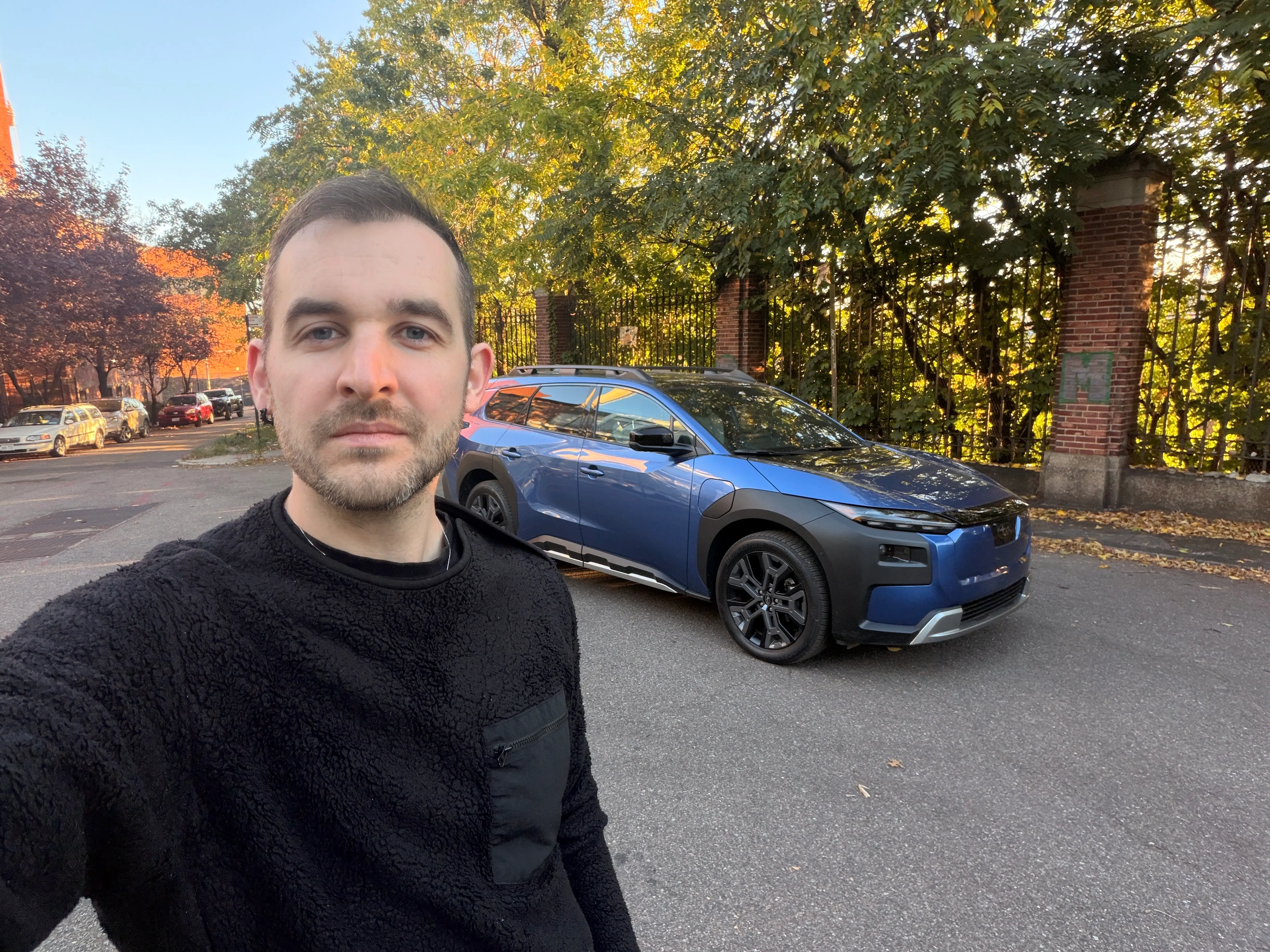 Ben Shimkus, Business Insider's autos reporter, is standing next to a 2026 Subaru Trailseeker.