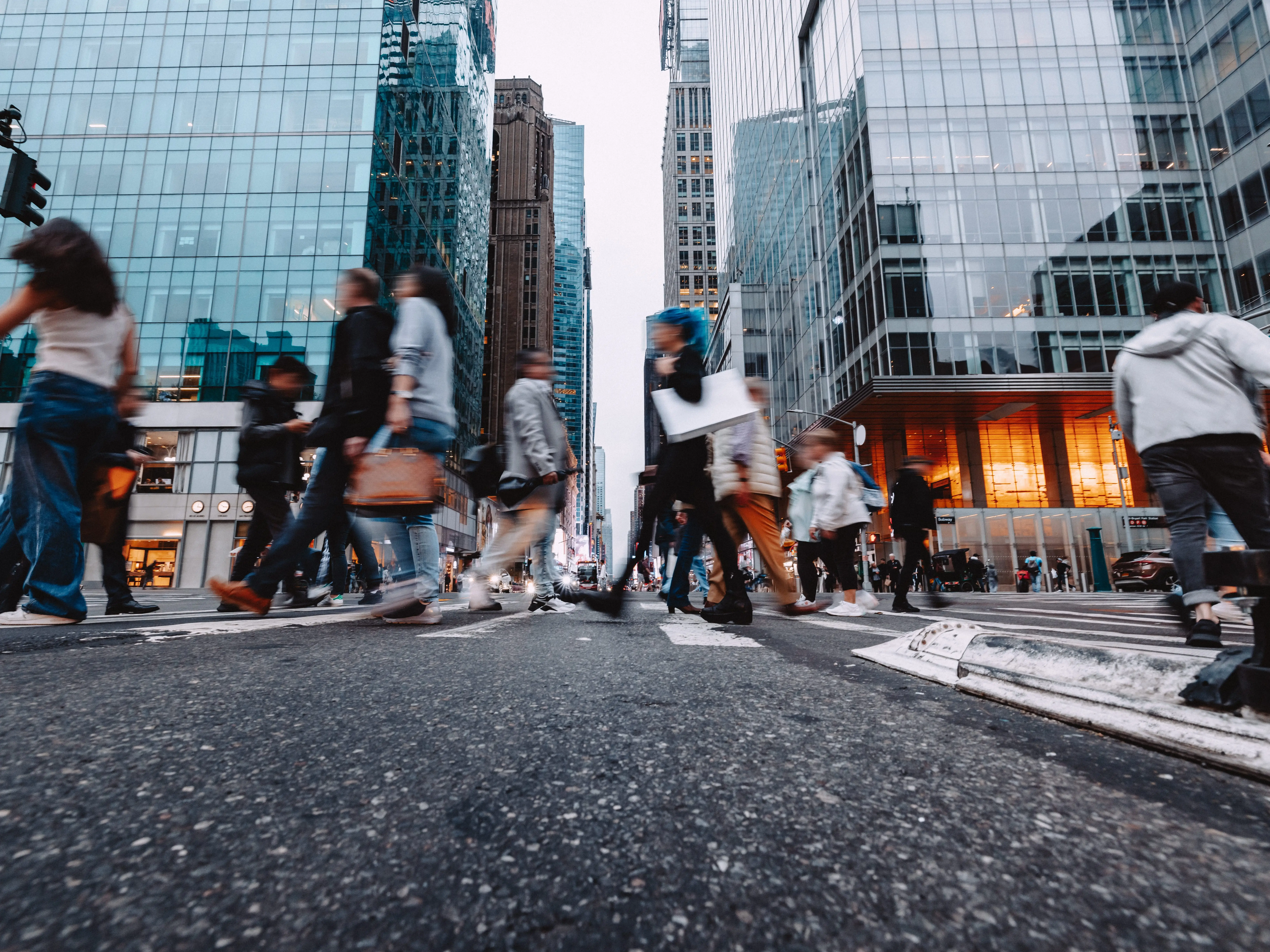 People crossing the street in a city