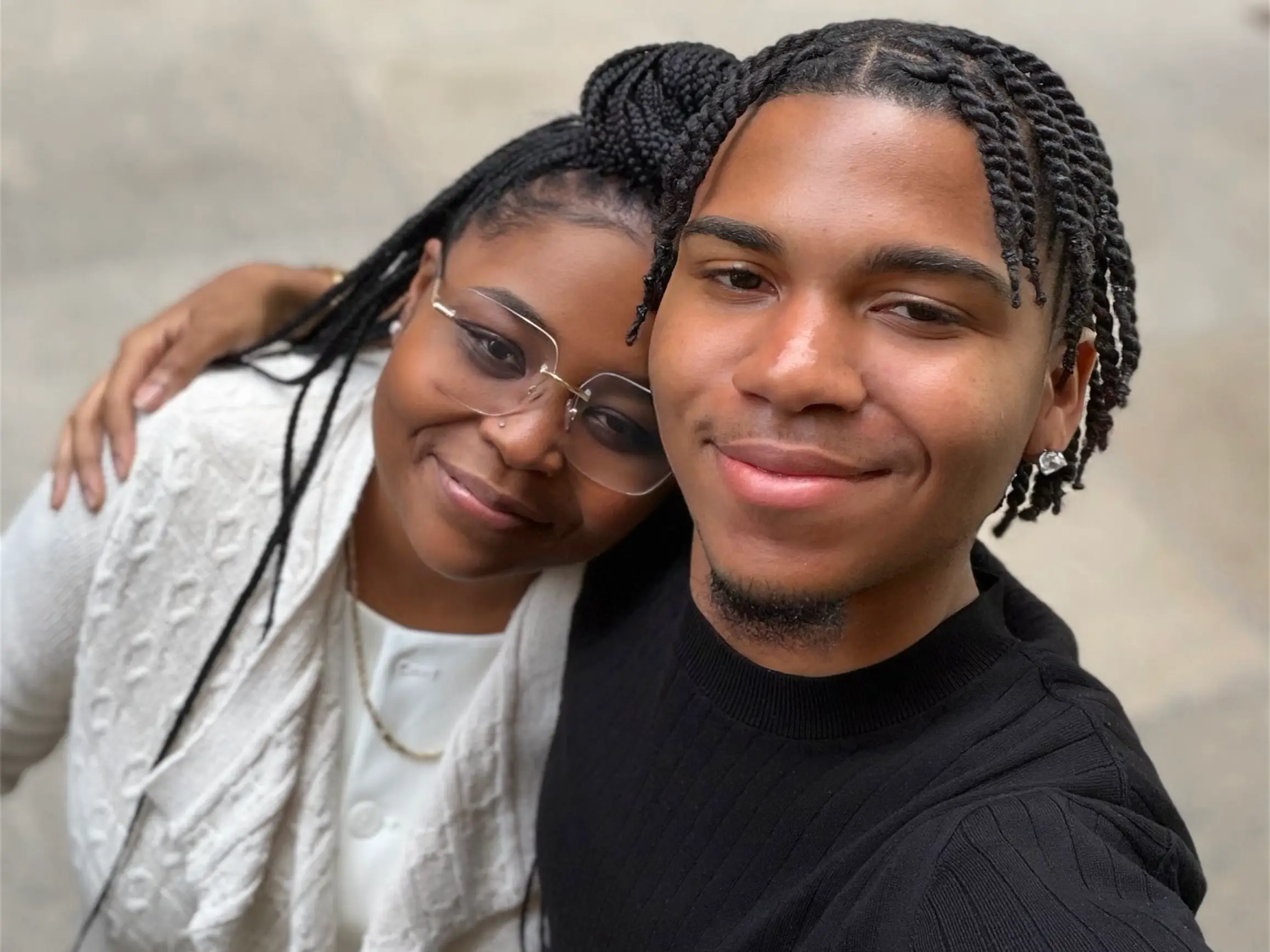The author smiling alongside his mother in a family photo.
