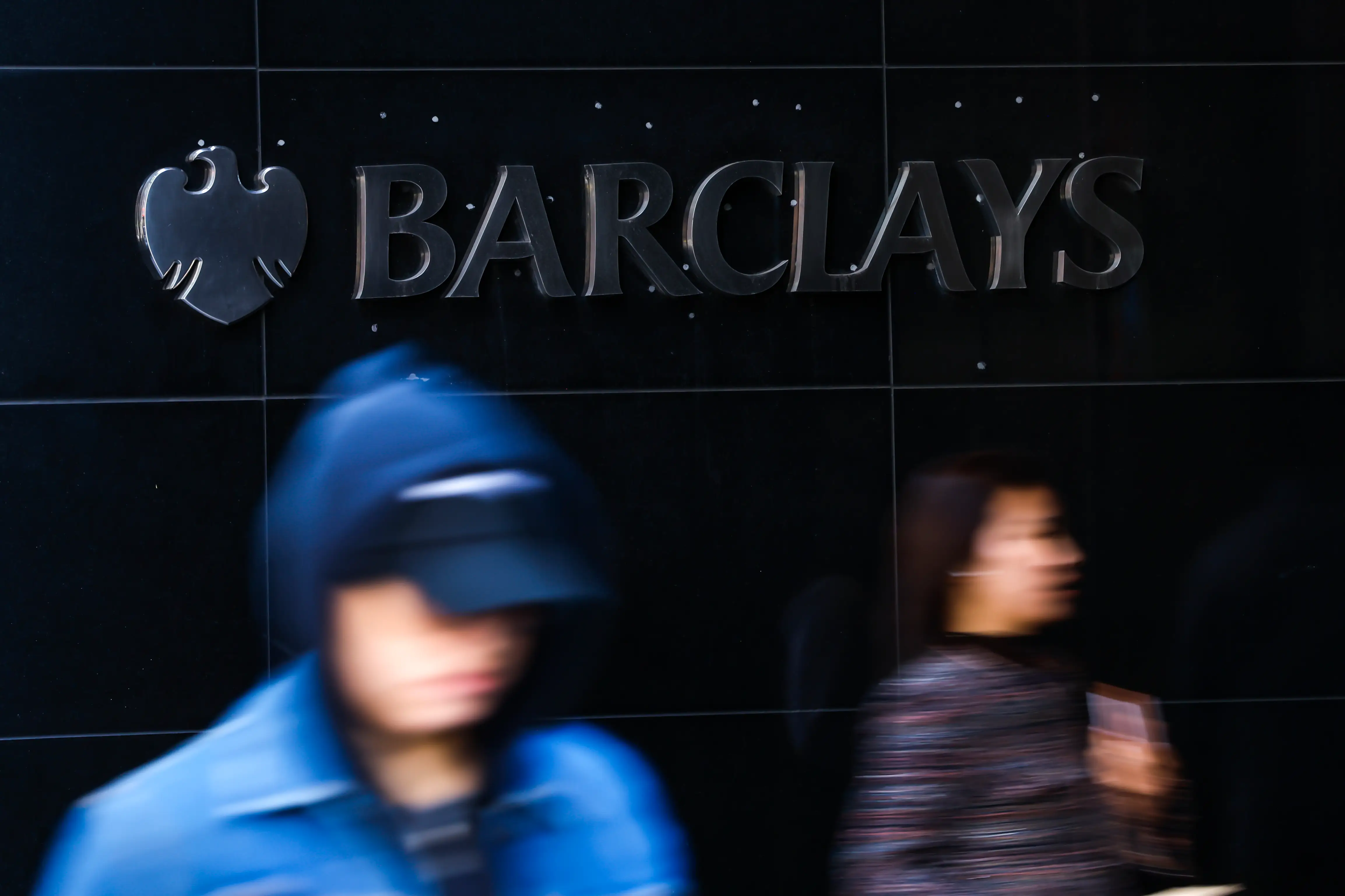NEW YORK, NEW YORK OCTOBER 21: People pass by Barclays PLC (BCS) headquarters on October 21, 2026. in New York City. Barclays shares (BCS) have gained approximately 218.5% over the past three years, as investors assess whether the bank's earnings justify its share price. (Photo by KHemaz/GVN via Getty Images)