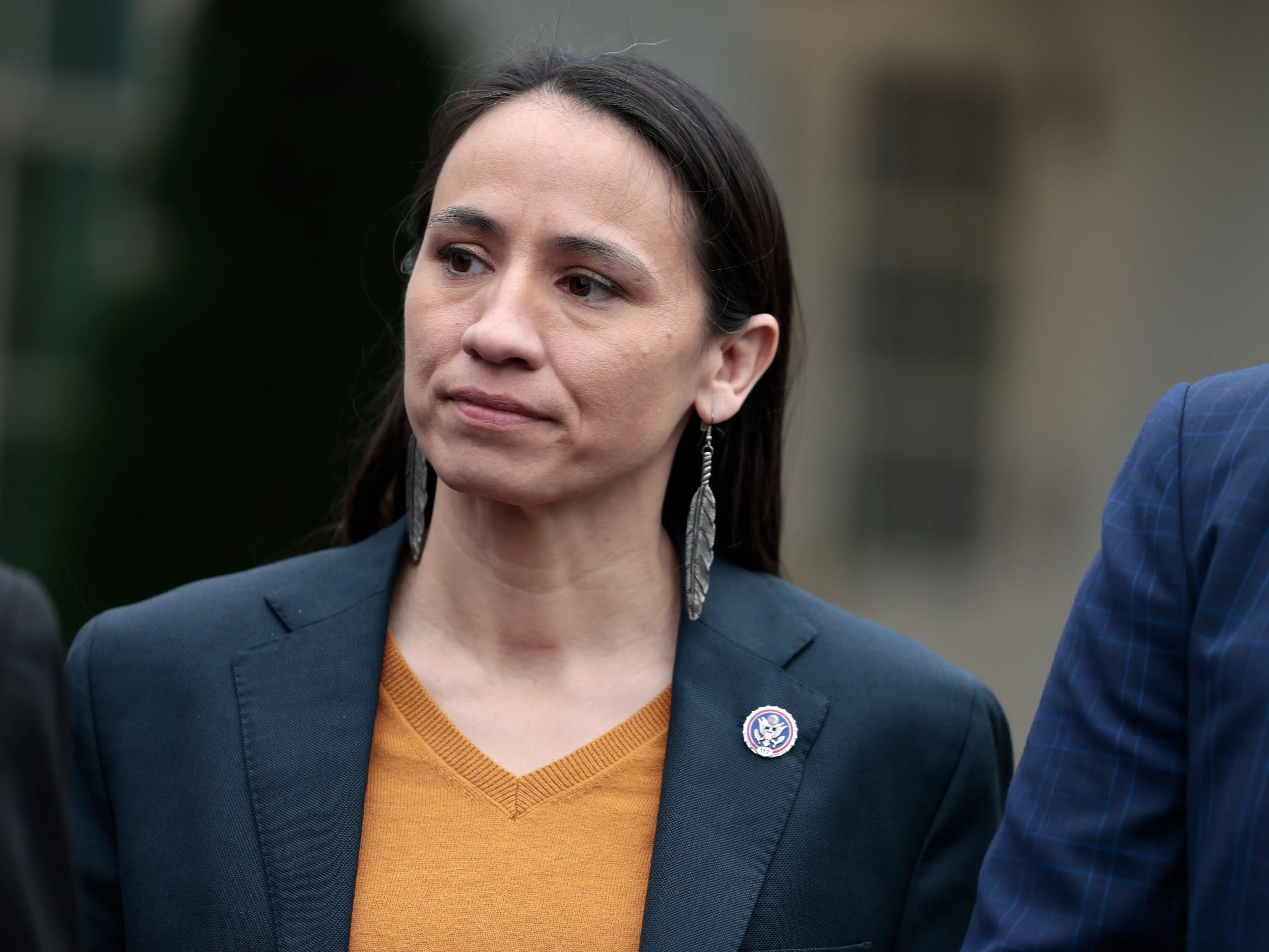 A woman in a suit.