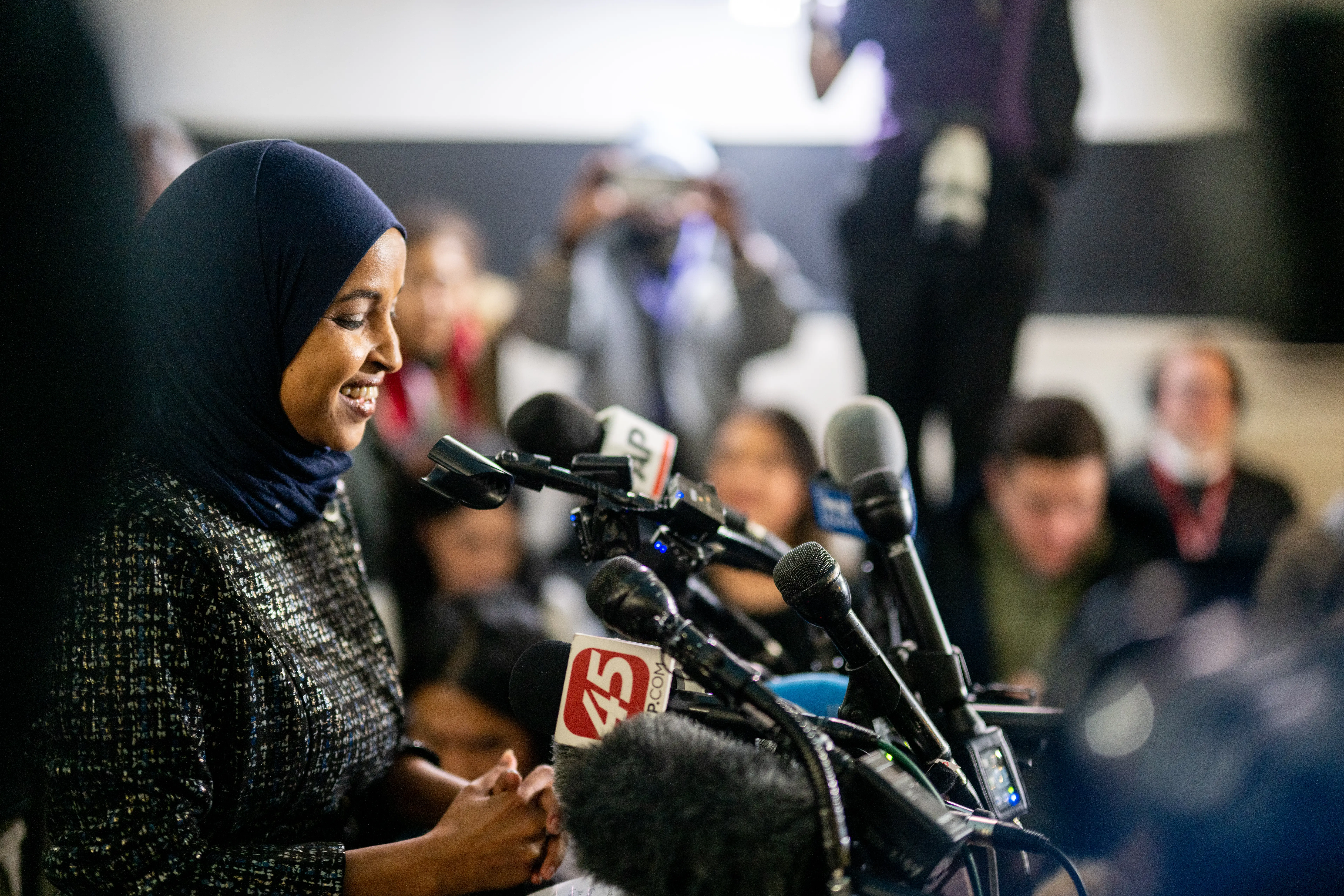 A woman in a suit speaks.