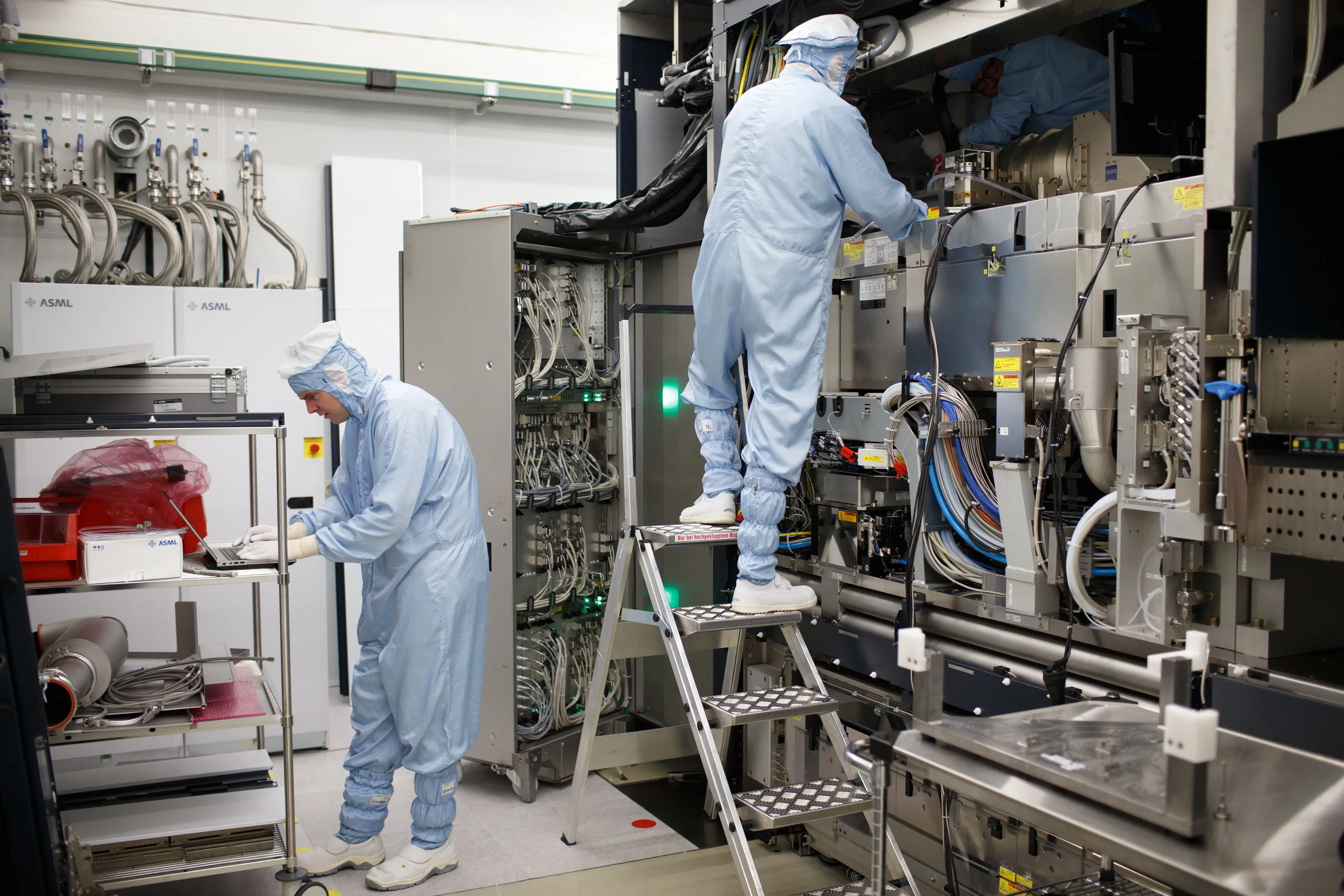 Employees assemble an ASML Twinscan XT1000 lithography machine at the ASML Holding NV factory in Veldhoven.