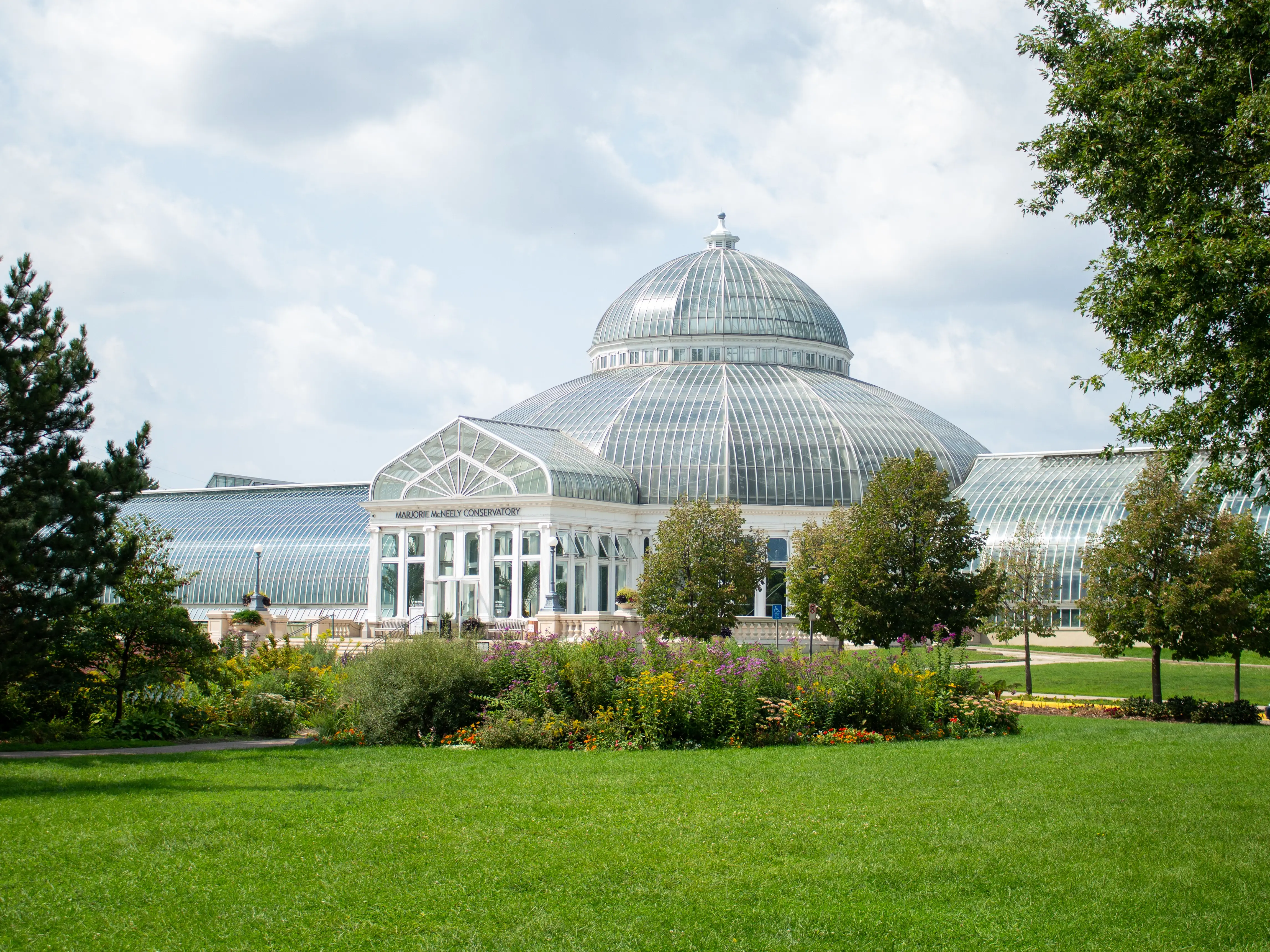 Saint Paul, Minnesota USA - September 2, 2017: Marjorie McNeely Conservatory at the Como Park Zoo and Conservatory. Built in 1915. U.S. National Register of Historic Places.