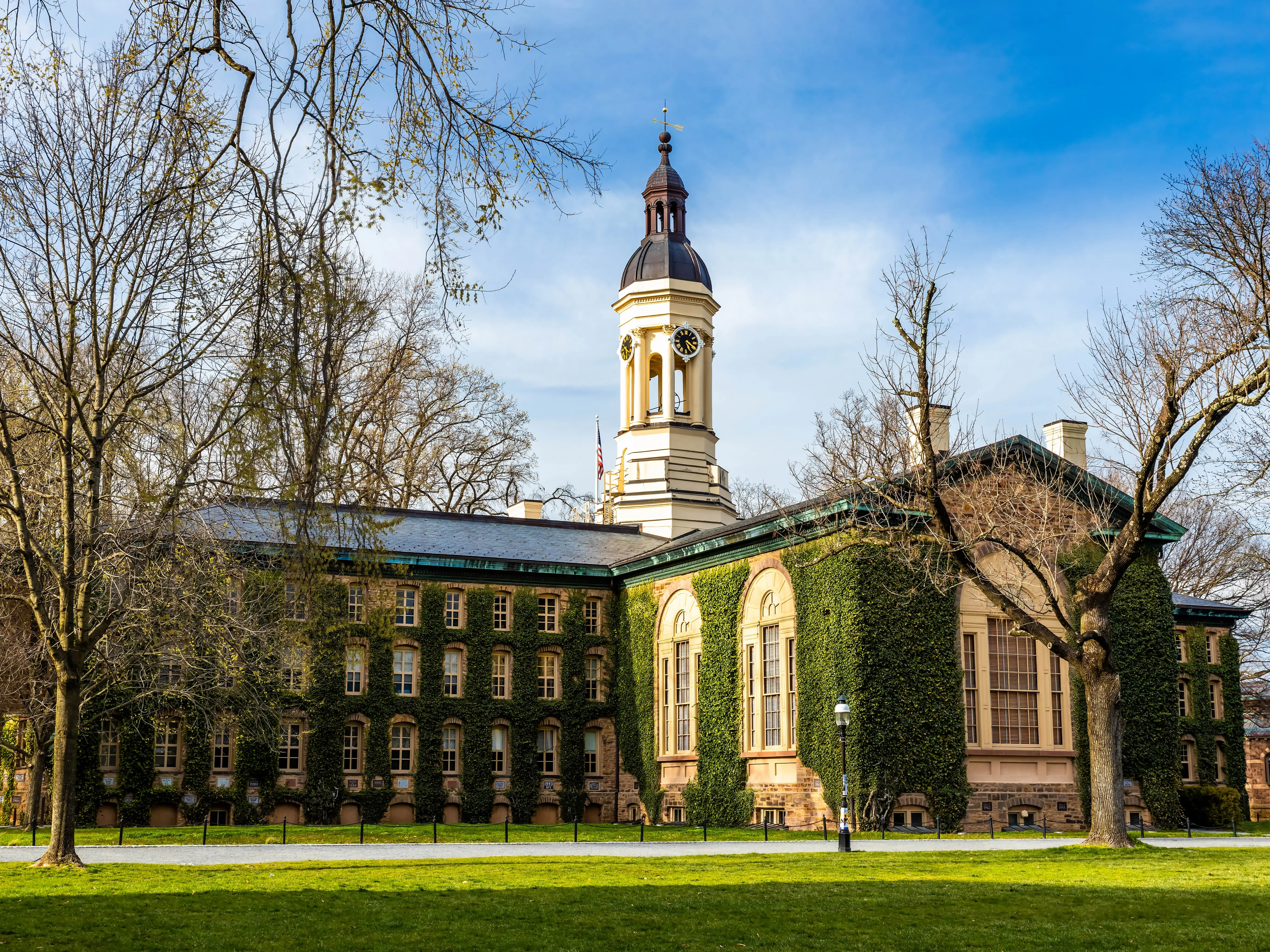 Famous Nassau Hall of Princeton university at sunset golden hour. This location (Princeton University Campus) is open to public and does not require any tickets or permissions to shoot.