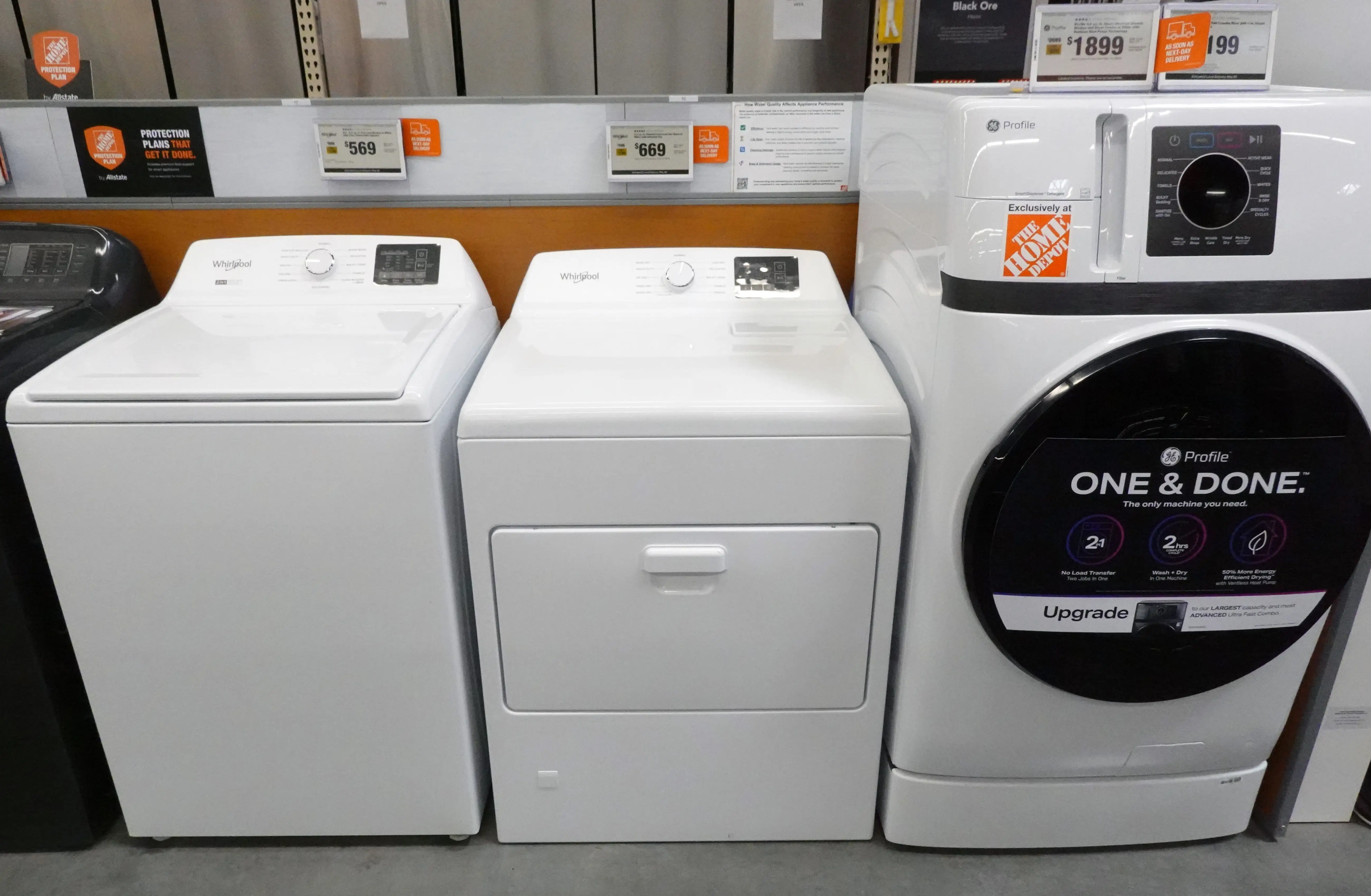 A Whirlpool washer (L) and dryer (C) are displayed for sale next to a GE washer/dryer combo in a Home Depot store on May 7, 2026 in Pasadena, California.