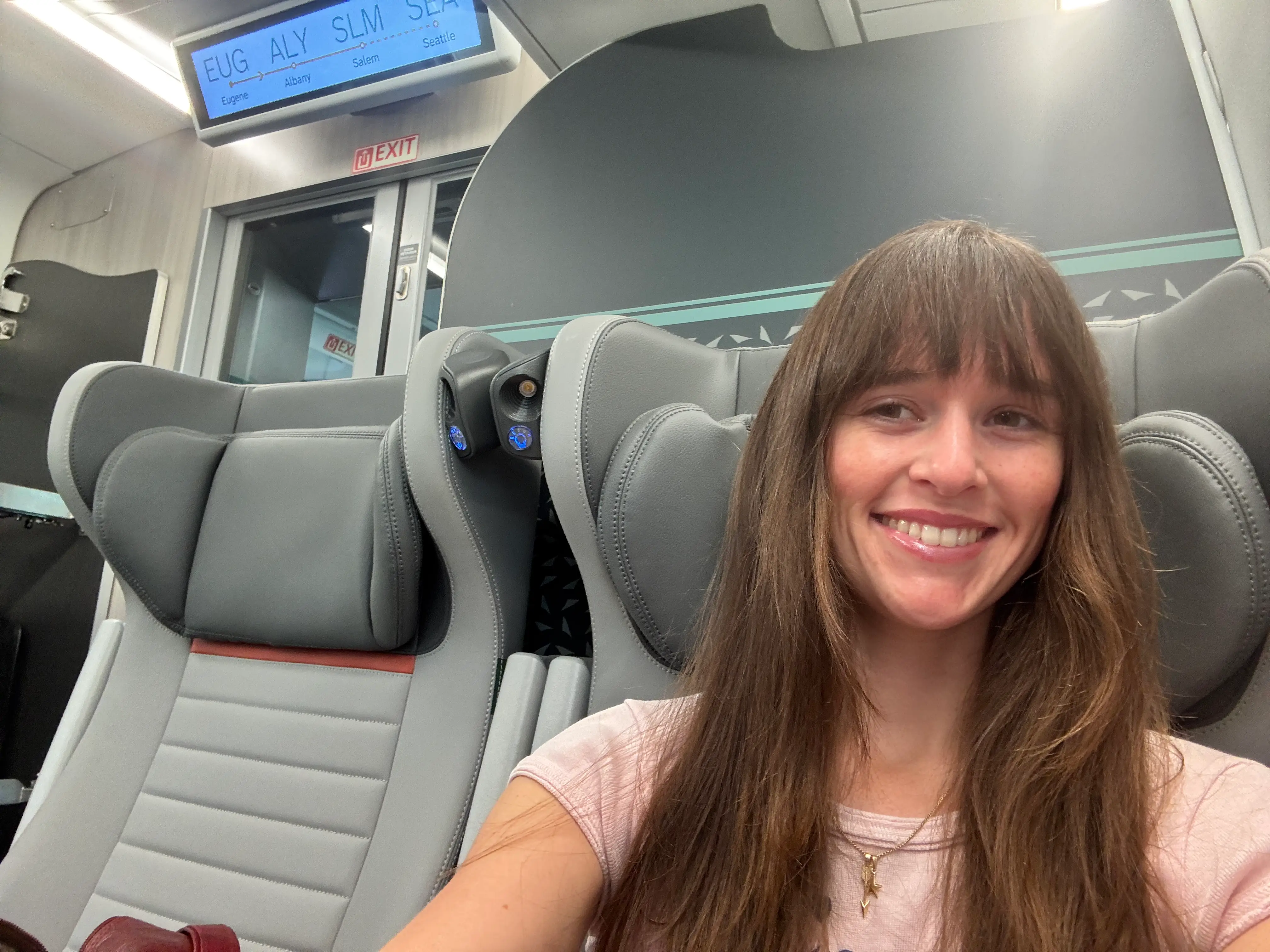 A woman takes a selfie.