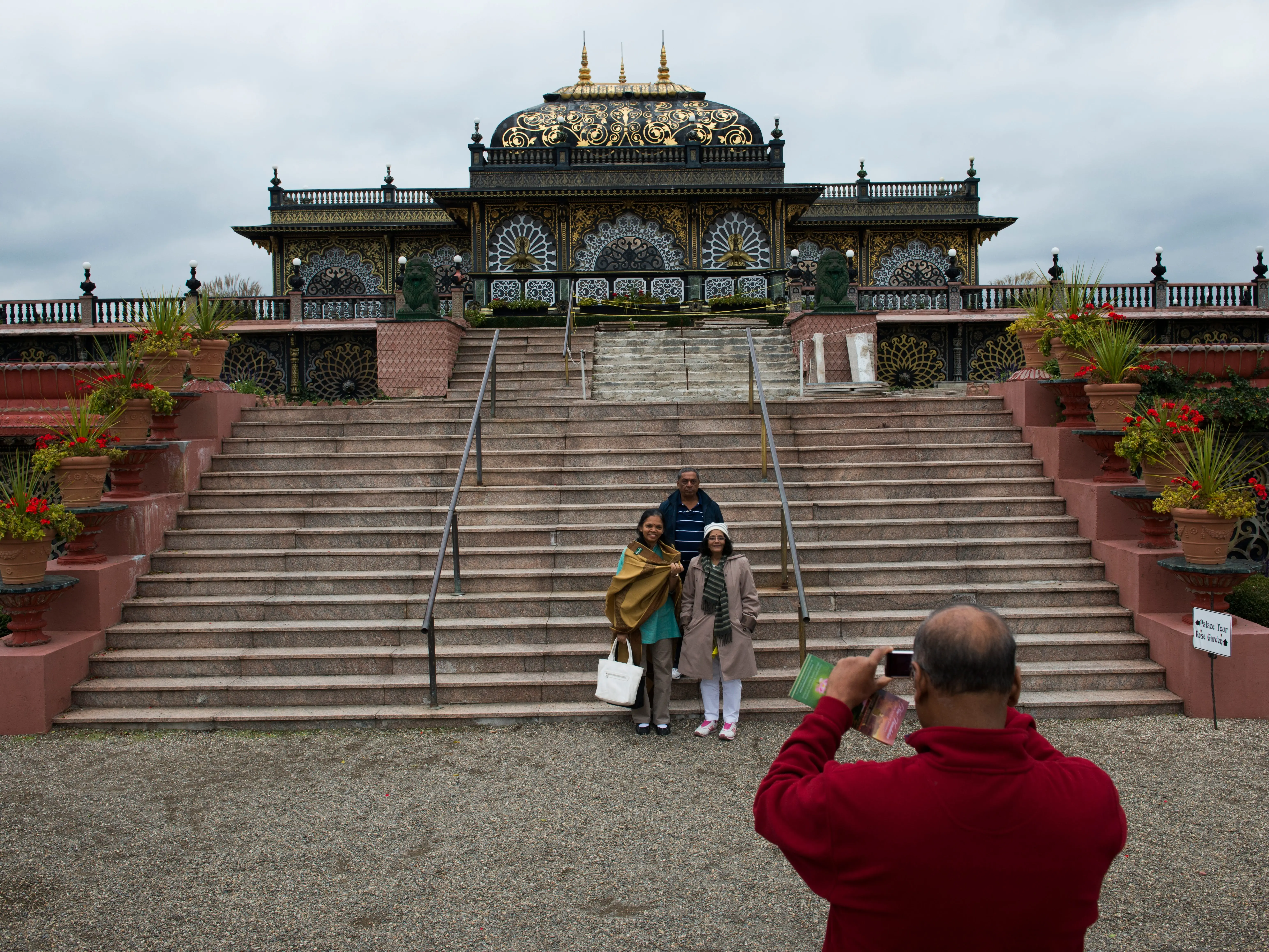 NEW VRINDABAN COMMUNITY, WVA - OCTOBER 10: Tourists visiting from India pose for photographs in front of the Palace of Gold on Oct. 10.