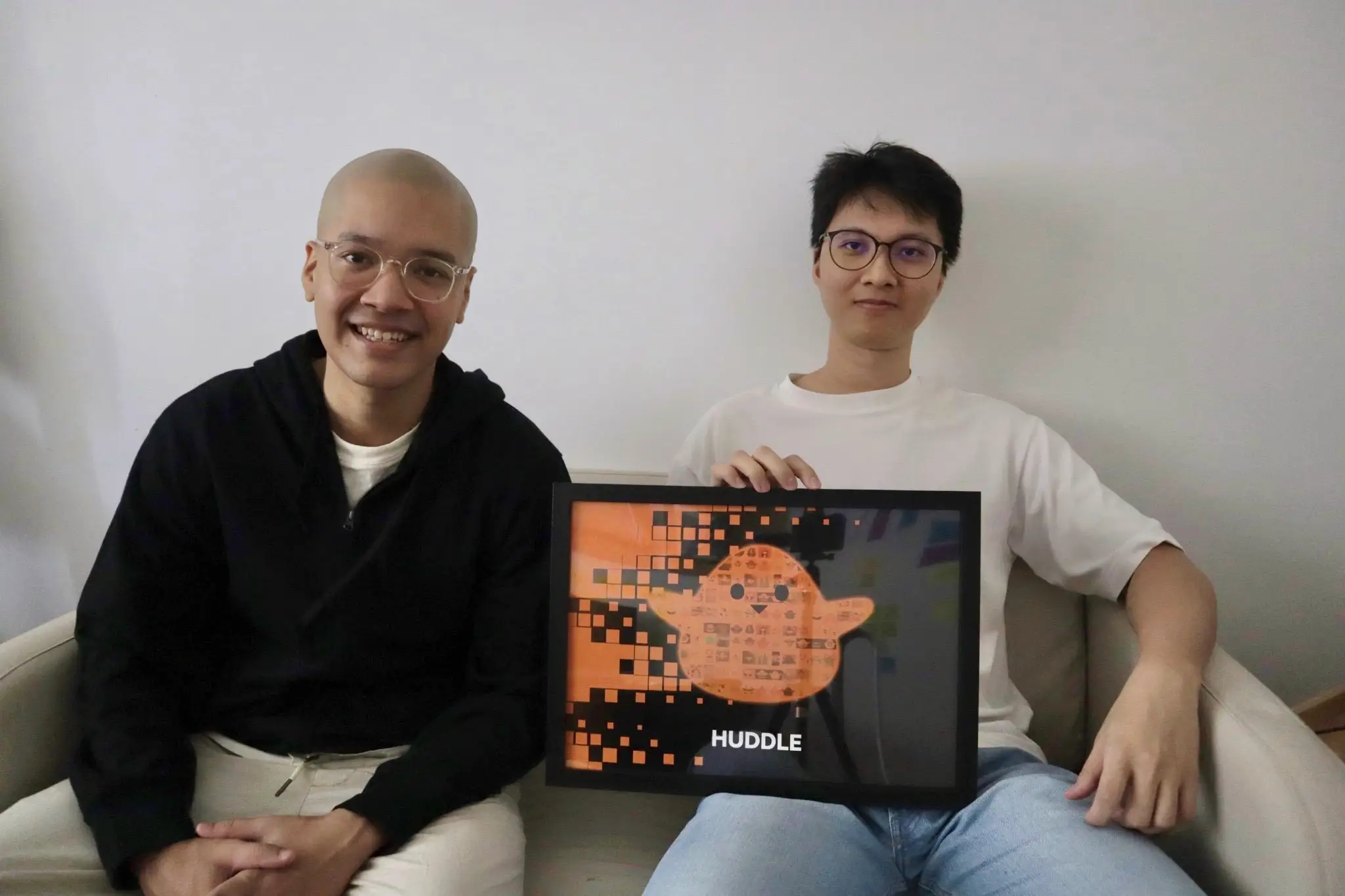 Two cofounders sitting on a couch.