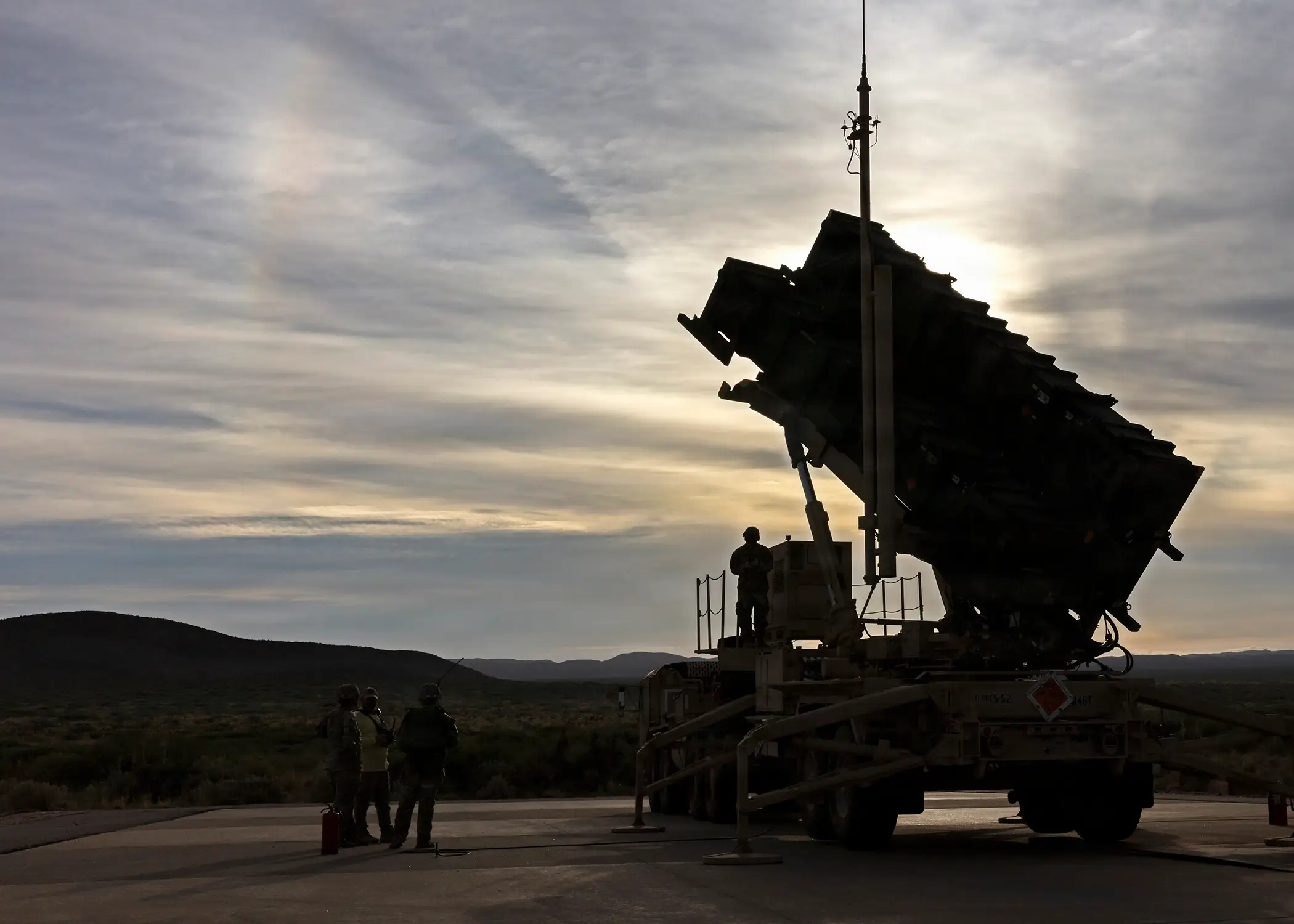 Soldiers and trainers stand on and around an elevated Patriot missile launcher at the Fort Bliss Training Complex in New Mexico, Sept. 19, 2026.