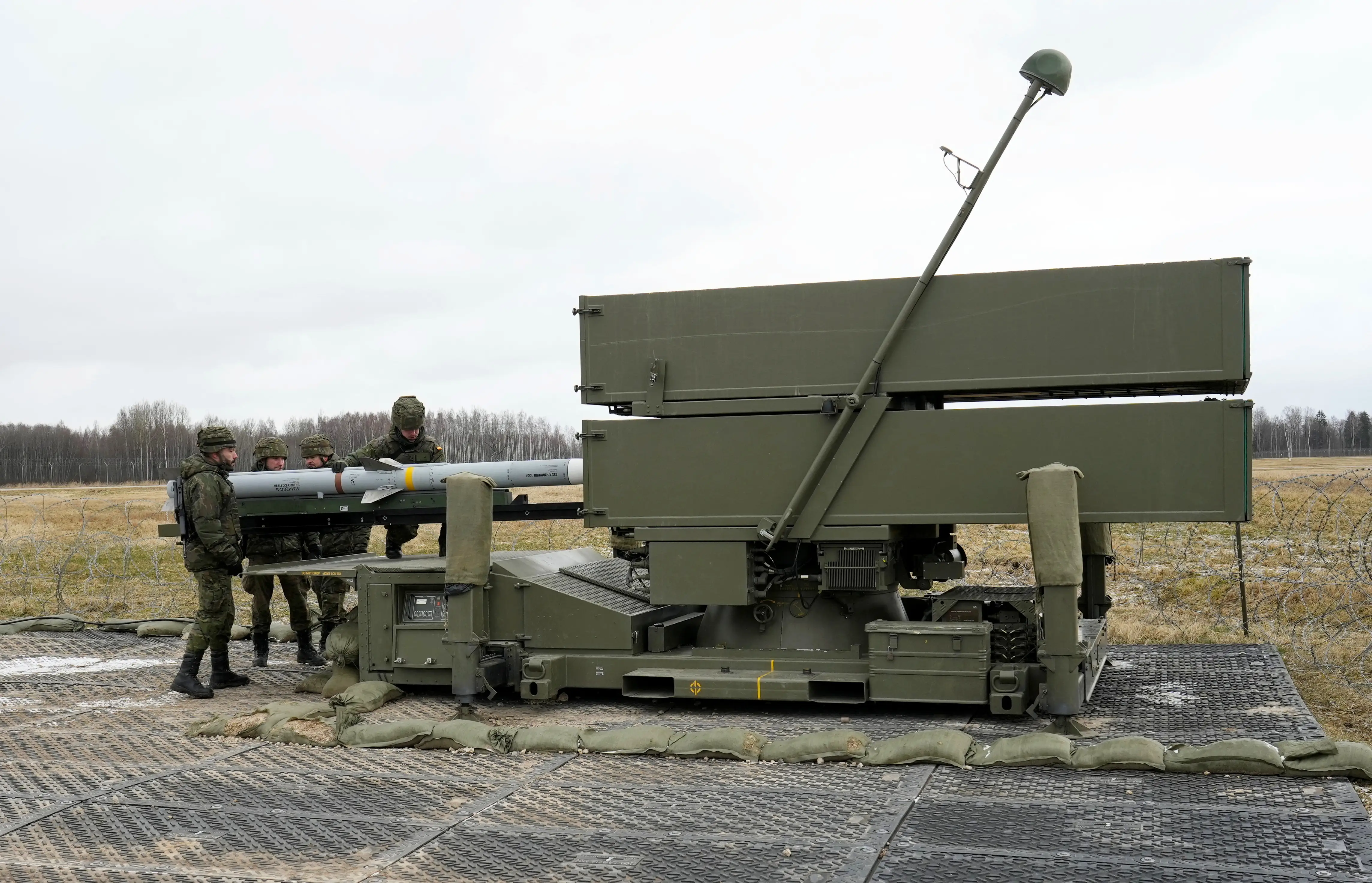 Spanish Army service members prepare a NASAMS medium-range, ground-based air-defense rocket launcher at Lielvarde Air Base, Latvia, on March 29, 2023.