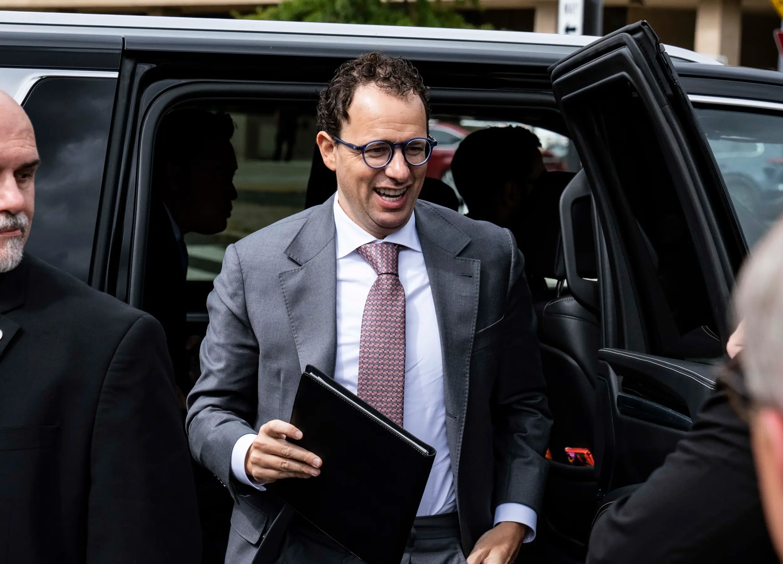 Dario Amodei emerges from a vehicle ahead of a White House meeting