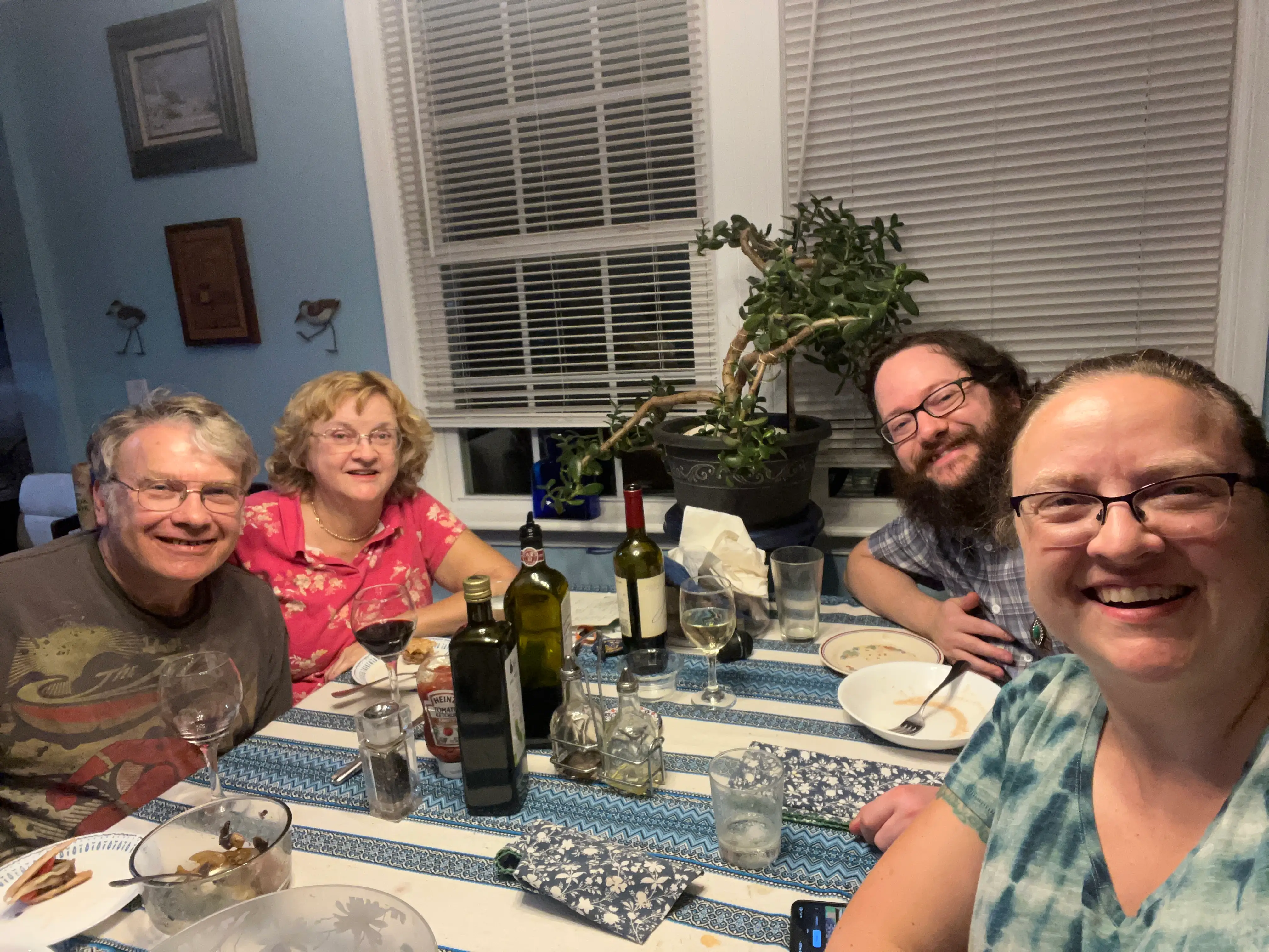 The writer, his wife, and his in-laws are sitting at the dinner table together.