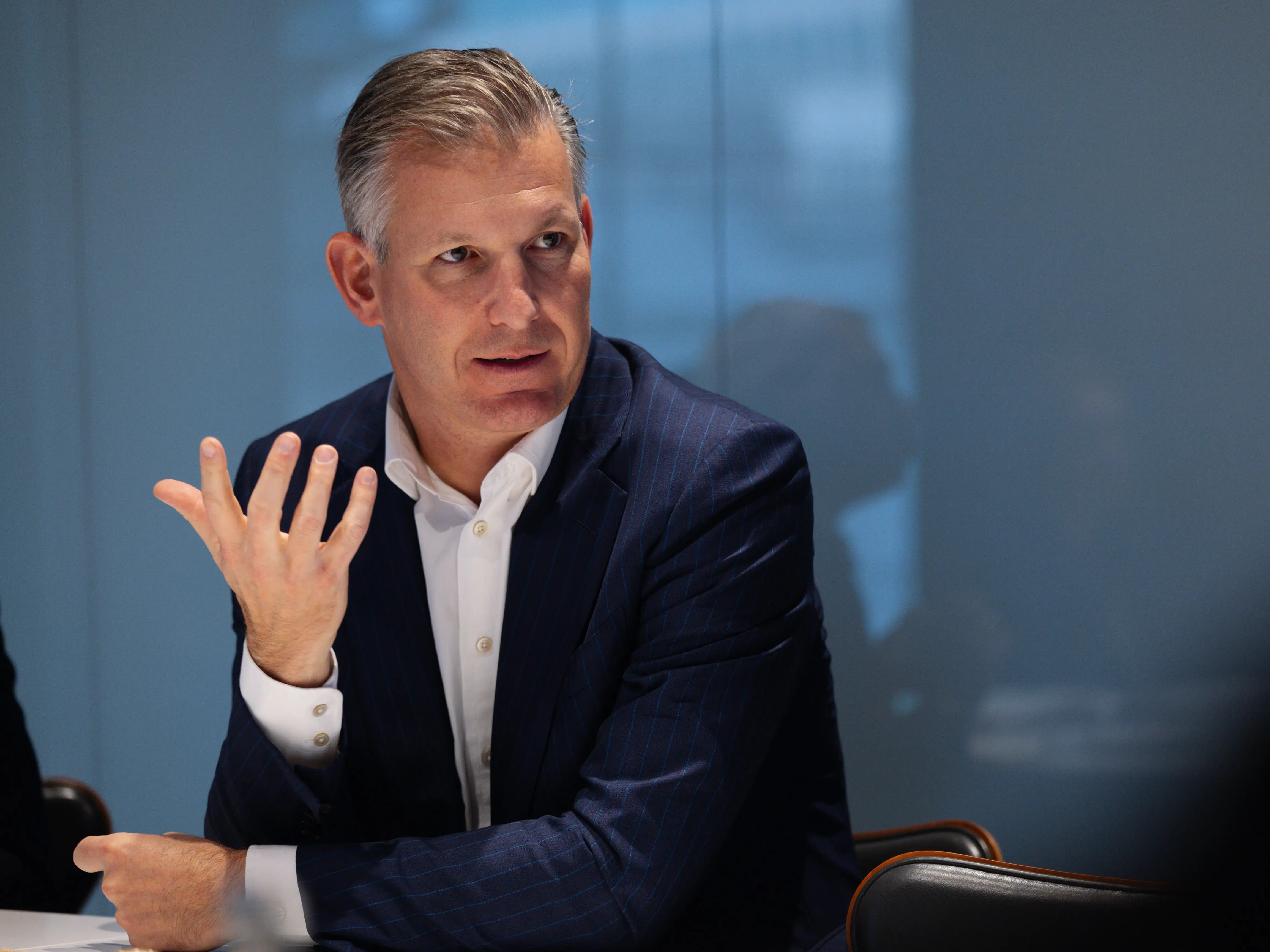 Philipp Navratil sitting in suit