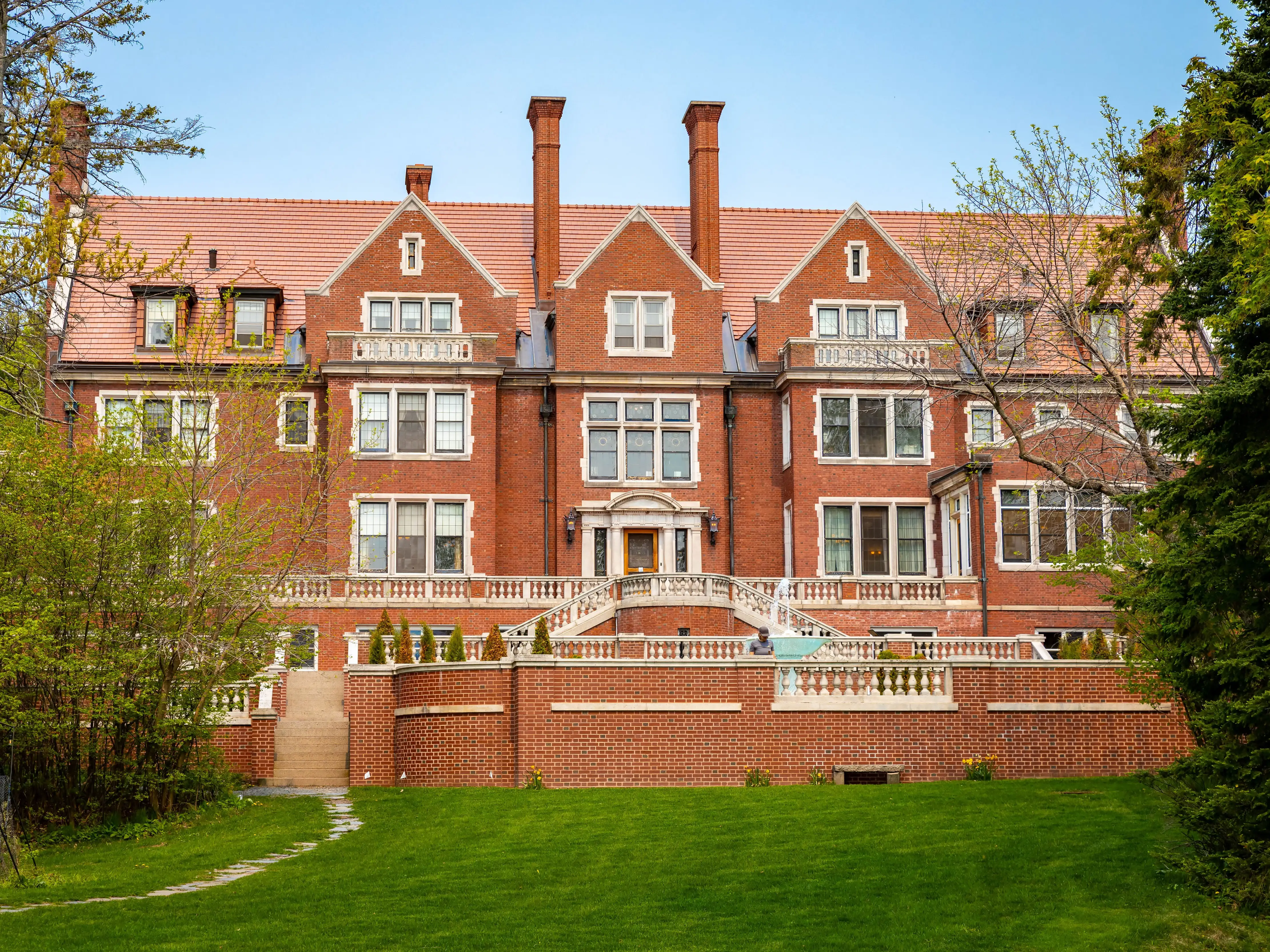 Duluth, MN, USA - June 27, 2025: Stunning front view of Glensheen Mansion, highlighting its grand architecture and the scenic beauty of its surroundings.