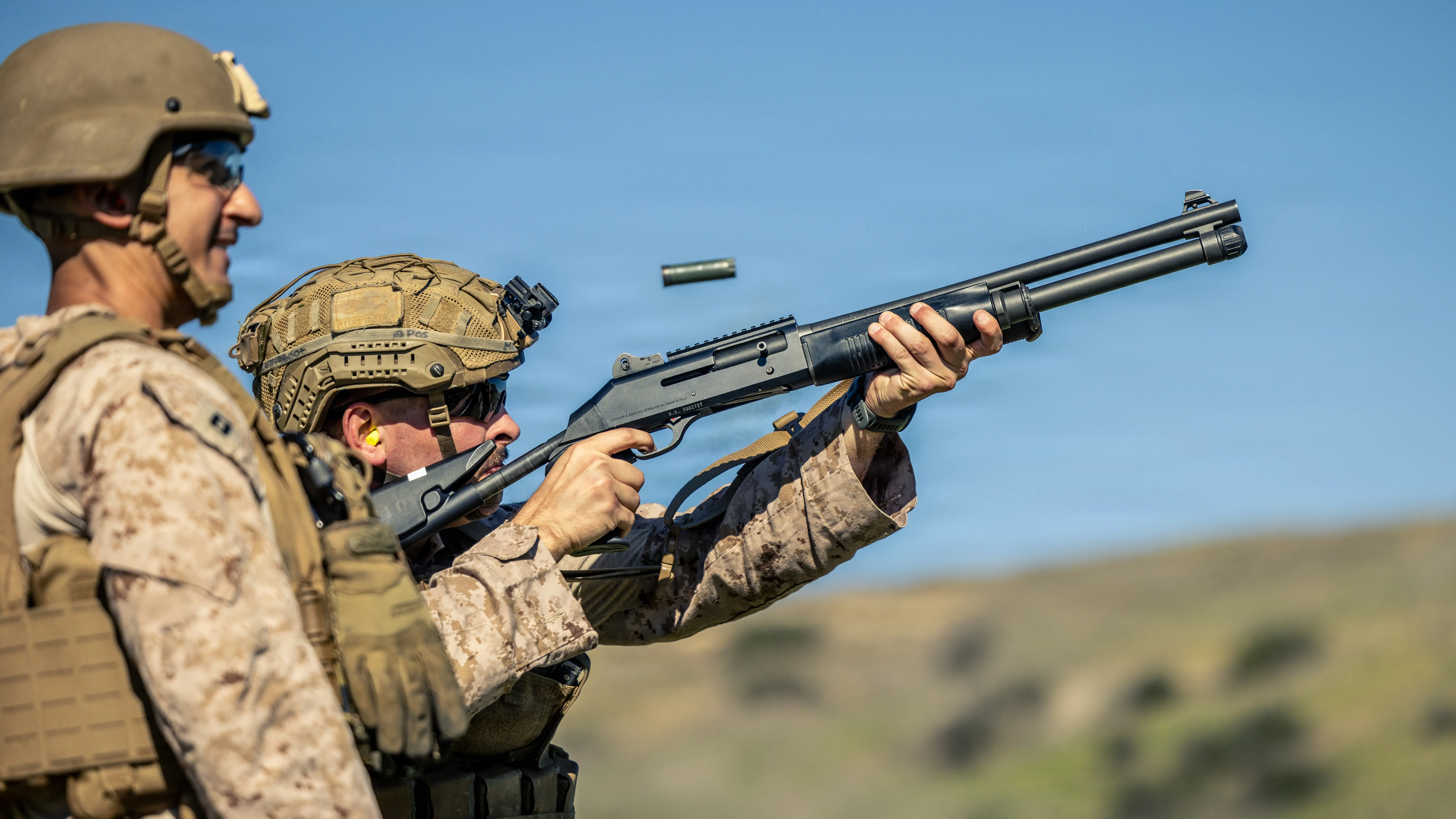 US Marines fire a shotgun during a counter-drone exercise.
