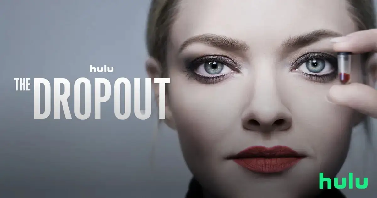 Amanda Seyfried as Elizabeth Holmes holding a vial of blood next to her face