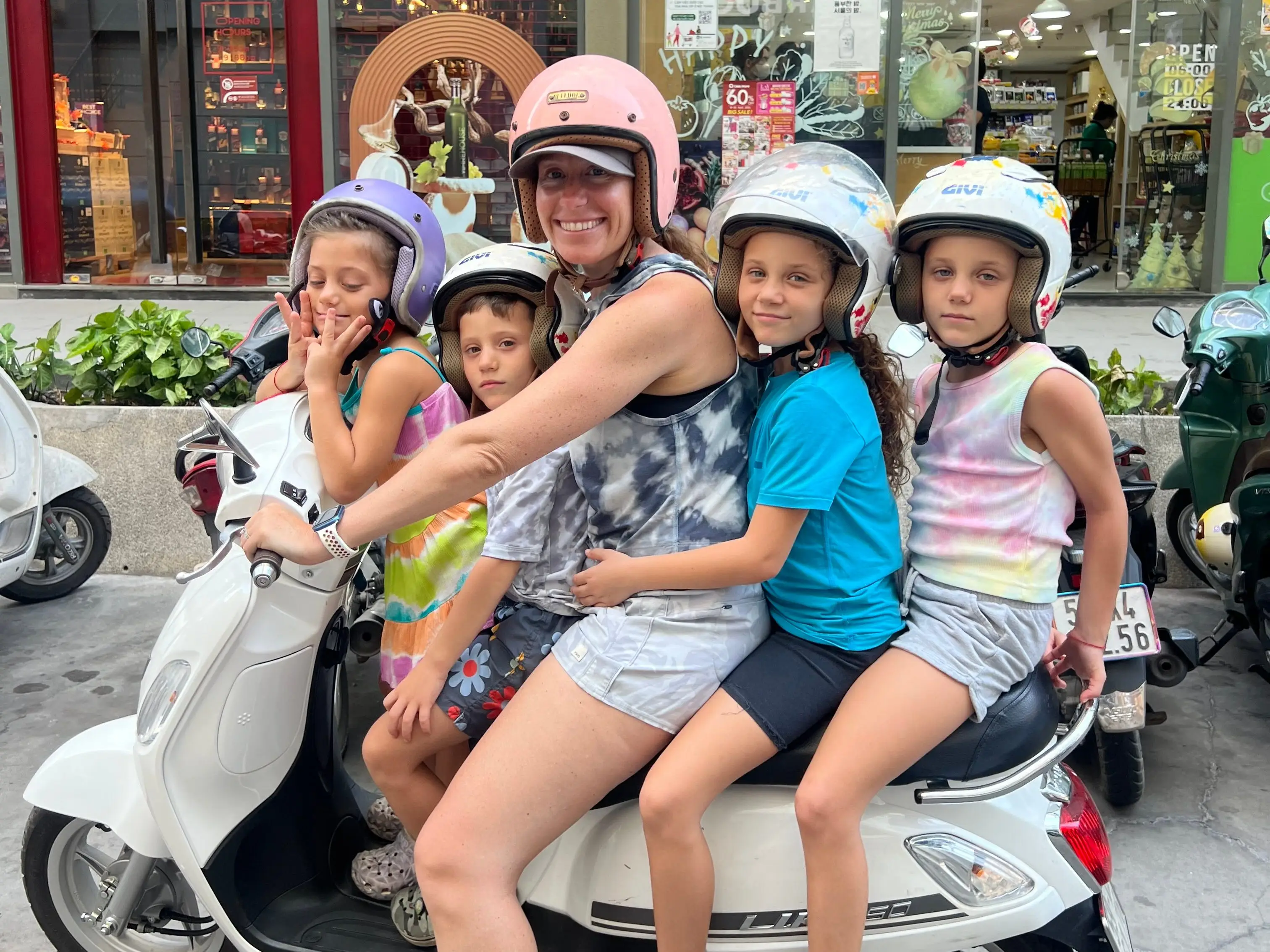 A woman with four children on a motorbike in Ho Chi Minch City, Vietnam.