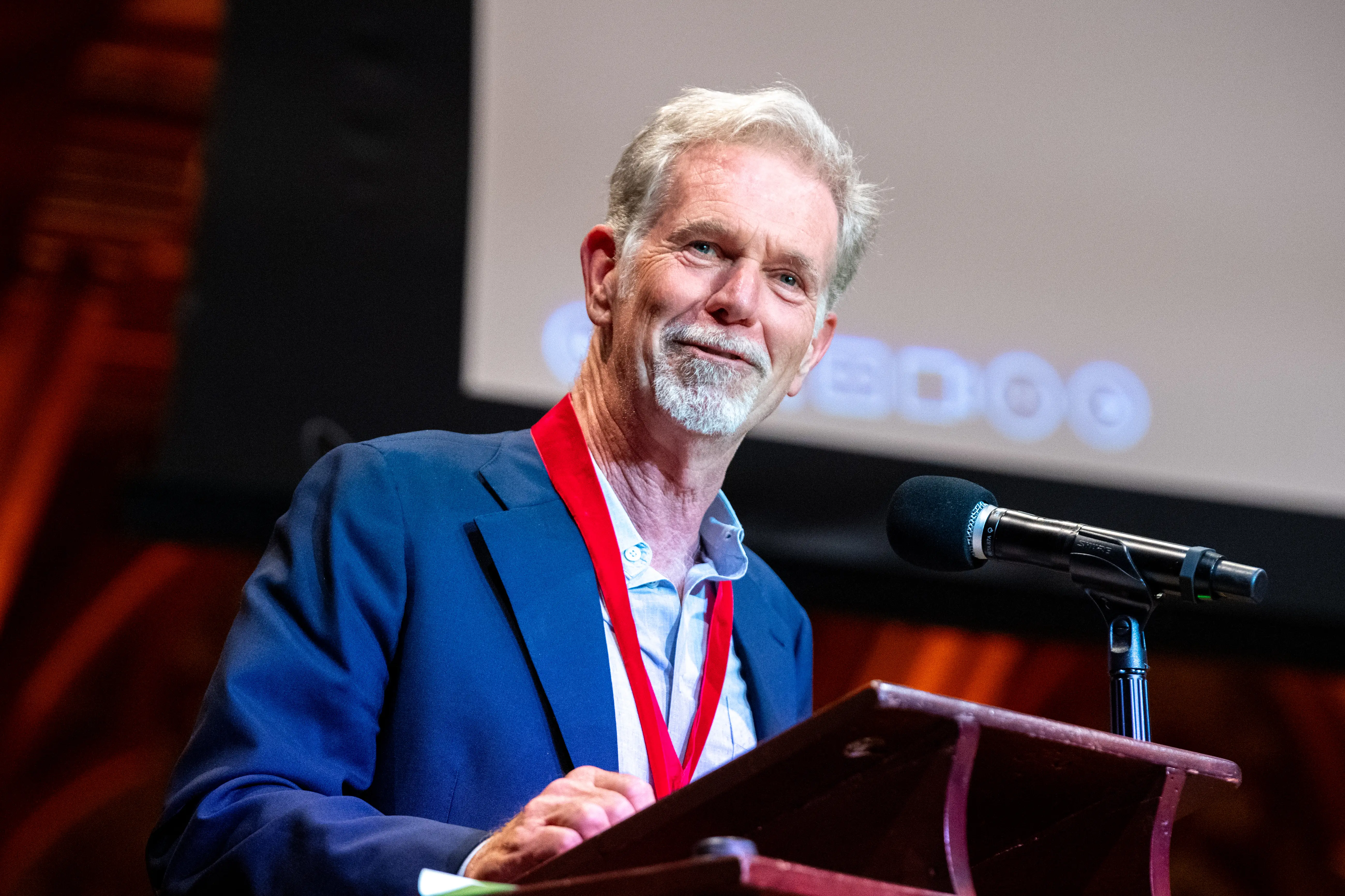 Reed Hastings, business executive and cofounder of Netflix, gives a speech after being presented with his medal during the Harvard University Hutchins Center Honors W.E.B. Du Bois Medal Ceremony on October 8, 2026, at Sanders Theatre in Cambridge, MA