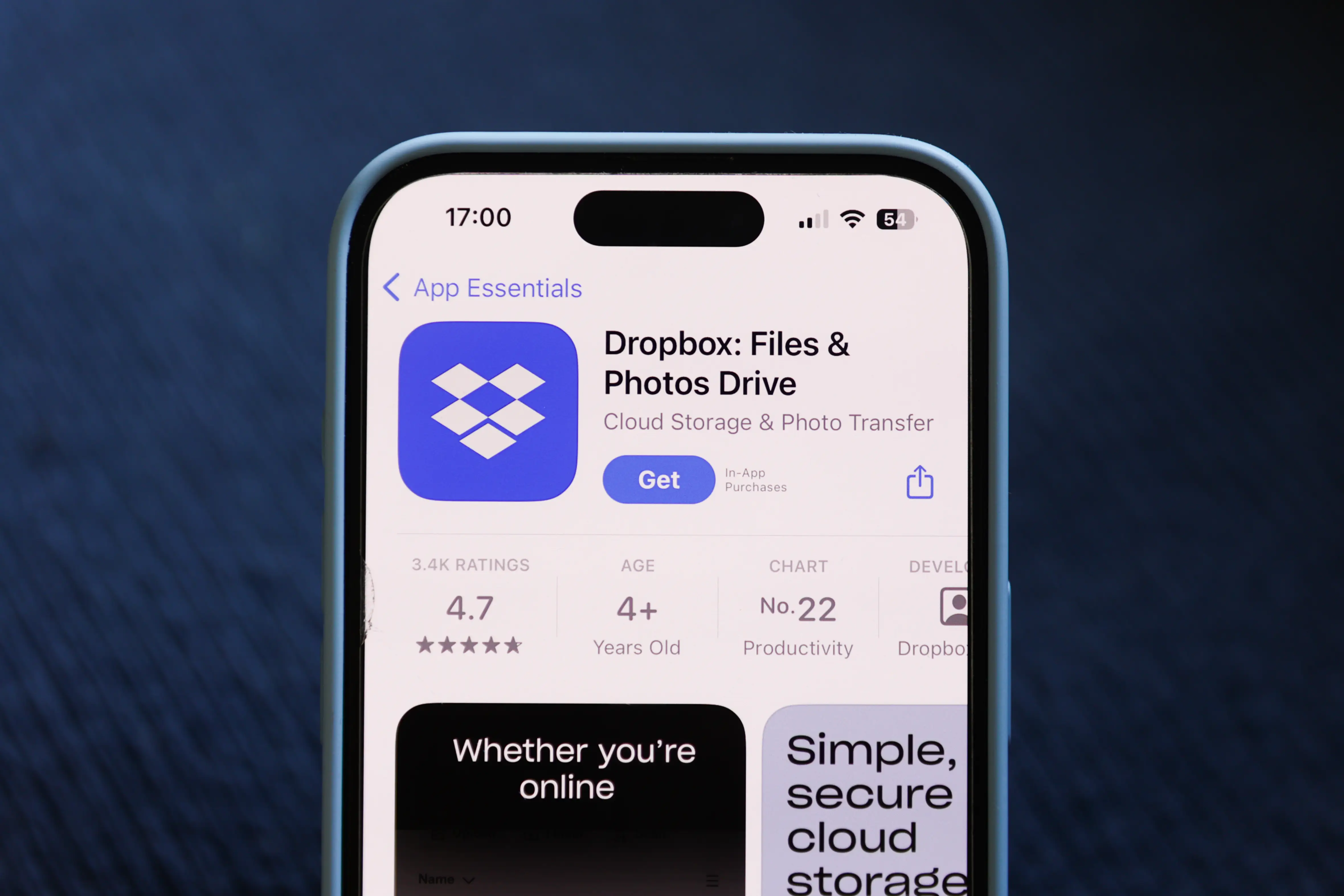 A phone shows Dropbox on the App Store.