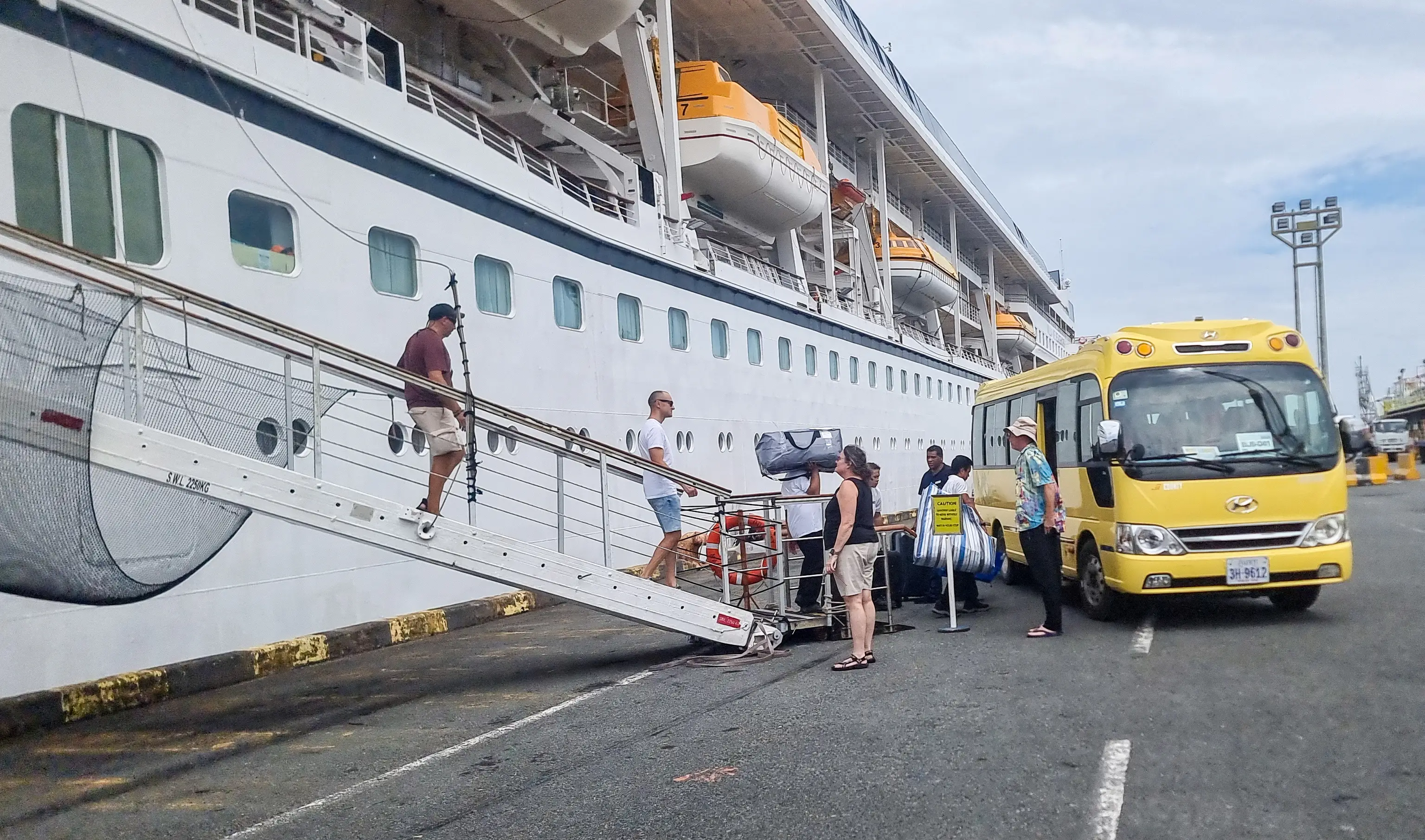 Passengers leaving the Villa Vie Residences' cruise ship Odyssey.