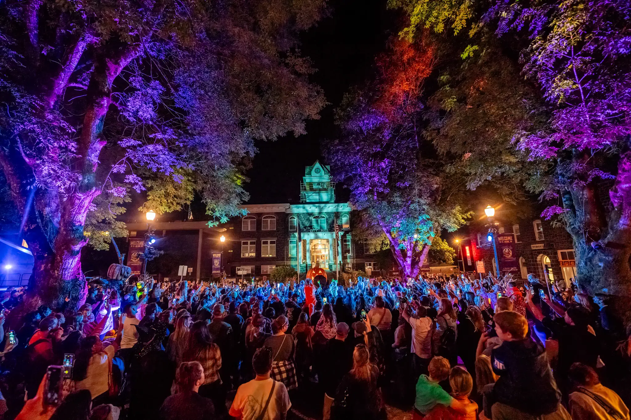 A courthouse at night during a party.
