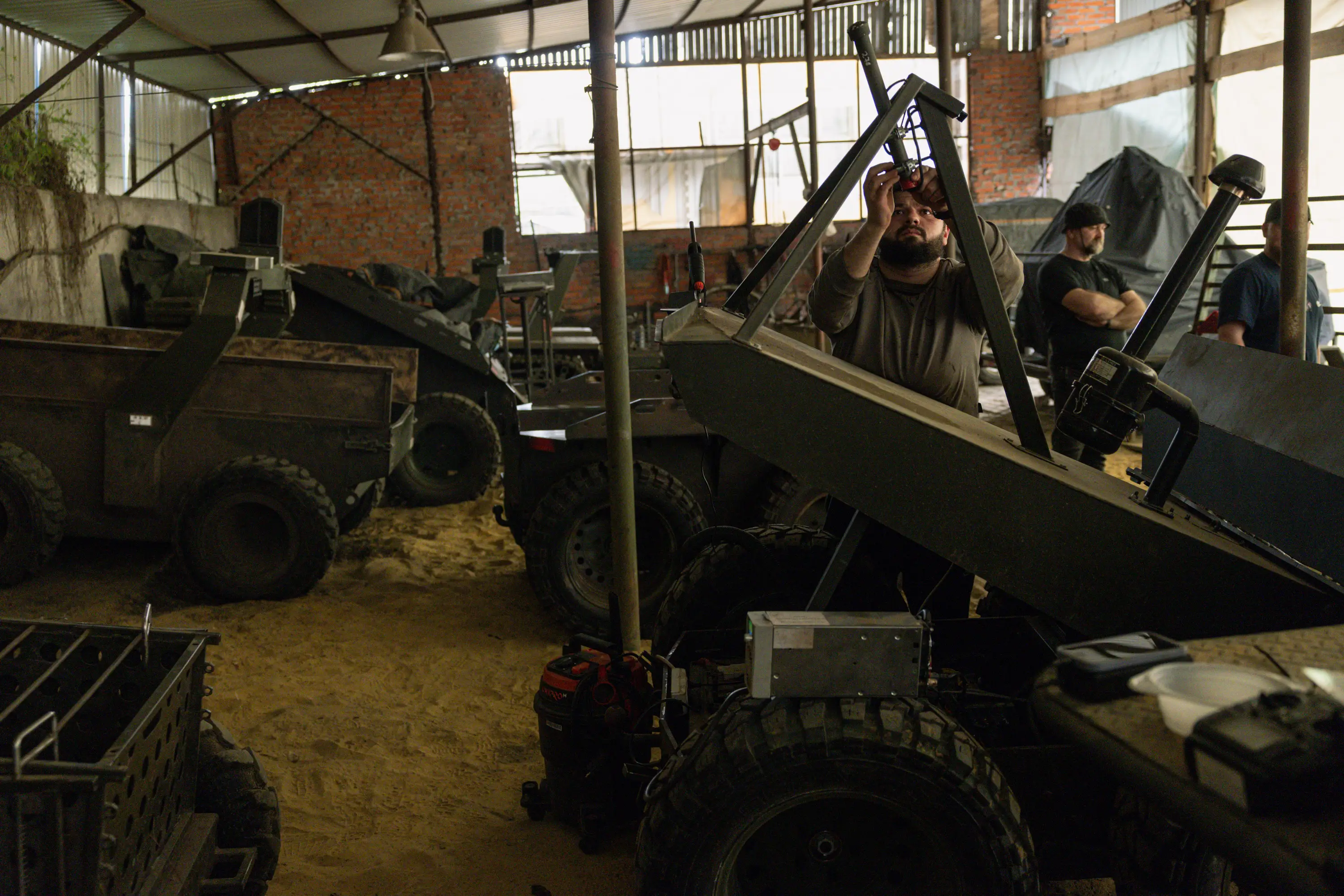 Members of the Lava Unmanned Systems Regiment repair multi-purpose unmanned ground vehicles at a workshop on May 22, 2026 in Kharkiv region, Ukraine.