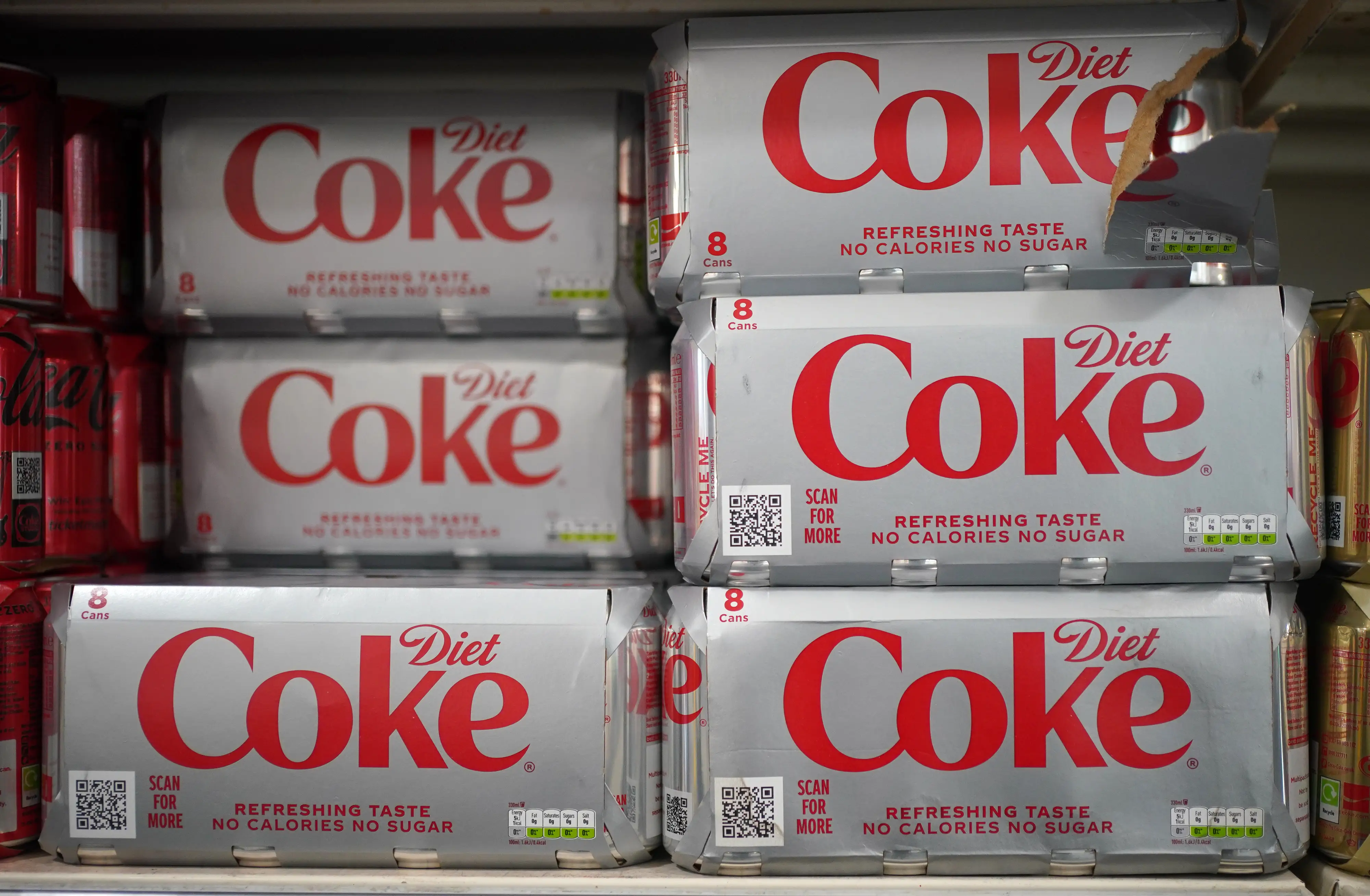 Cans of Diet Coke in a supermarket, as an artificial sweetener commonly used in thousands of products including diet fizzy drinks, ice cream and chewing gum is to be listed as posing a possible cancer risk to humans, according to reports. Aspartame will be listed as