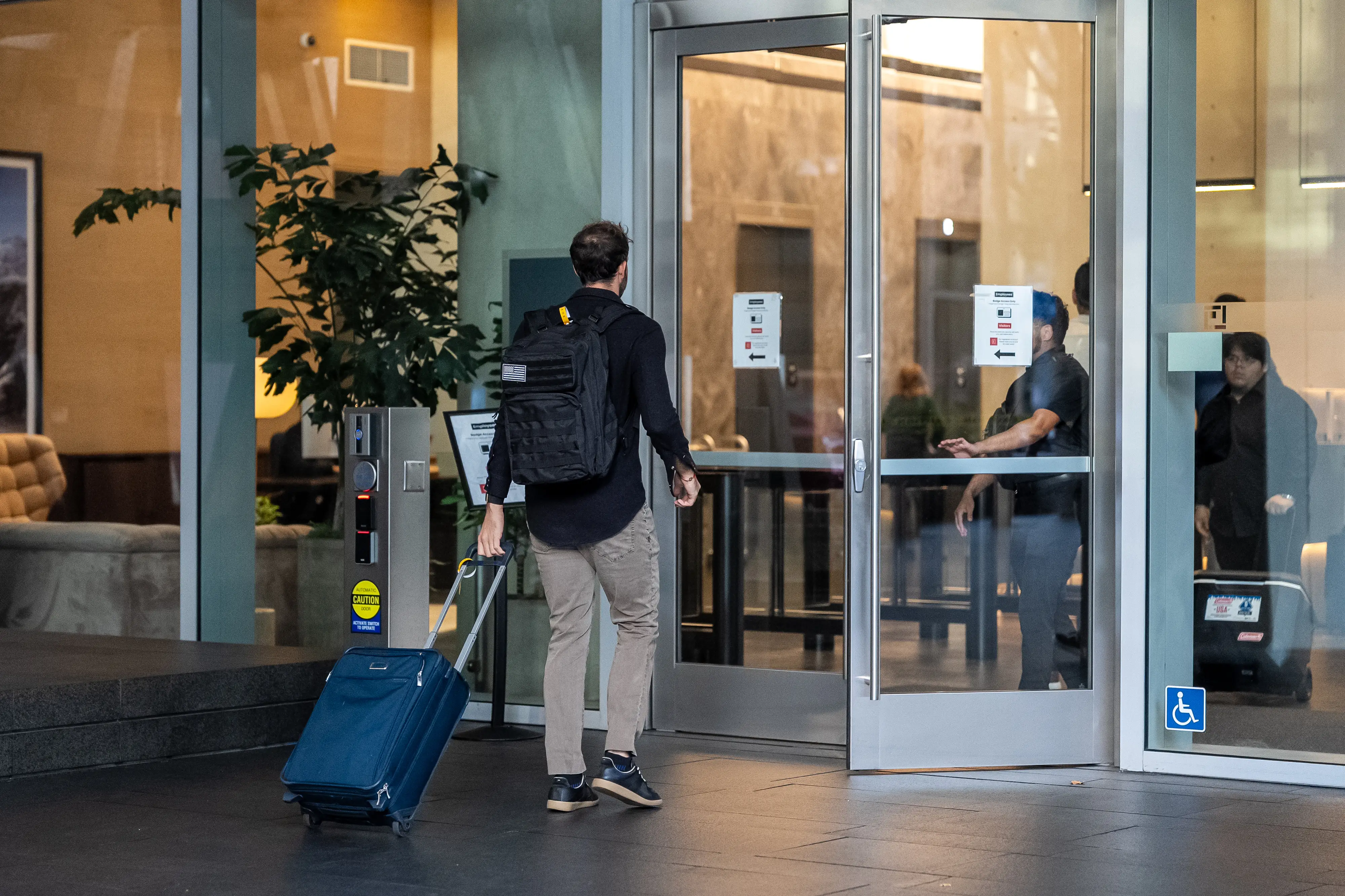An attendee enters the Anthropic headquarters during an investor day in San Francisco, California, US, on Wednesday, Oct. 14, 2026.