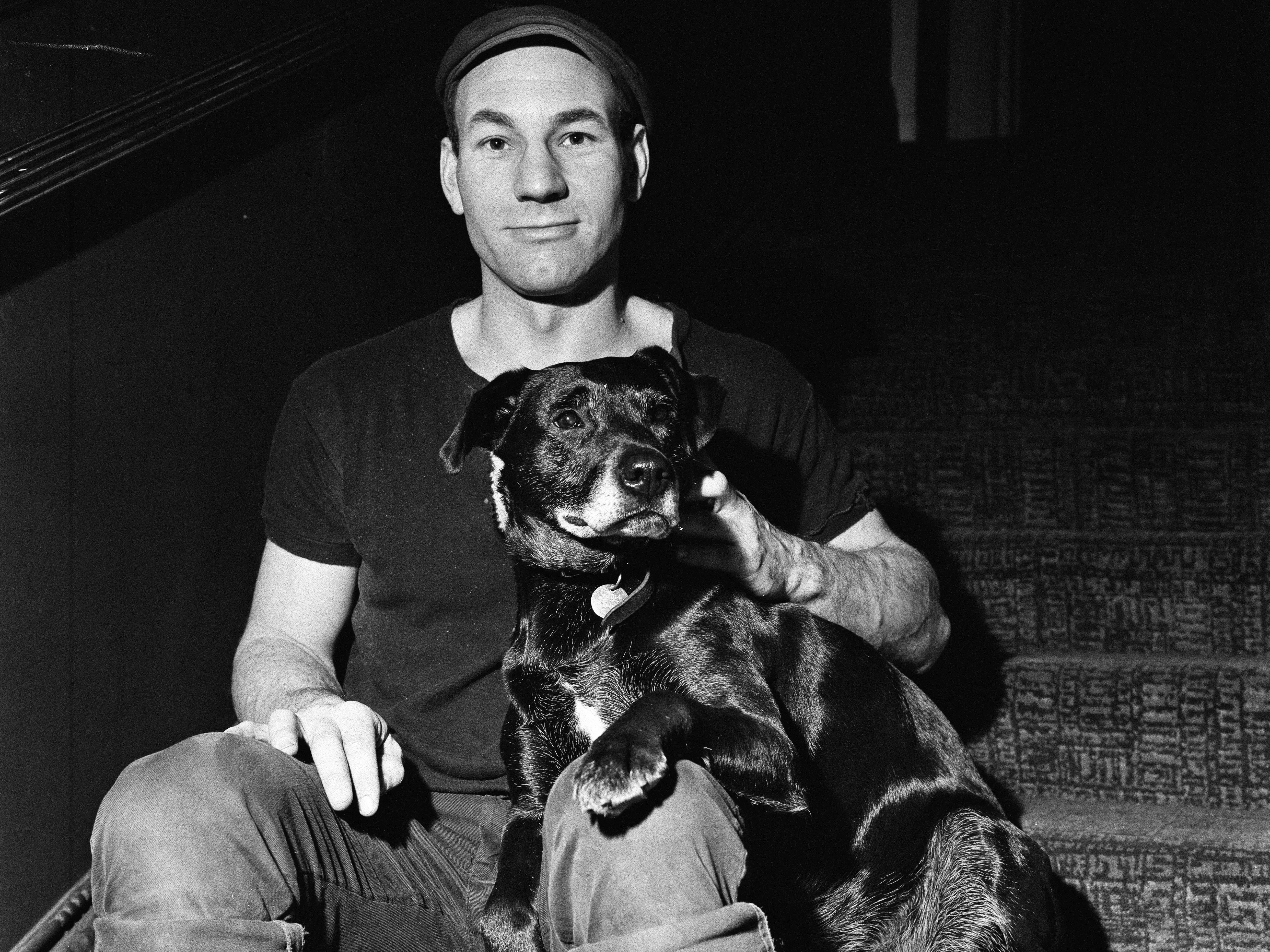 Patrick Stewart, who is starring as Launce in The Royal Shakespeare Company's production of The Two Gentlemen of Verona, with Blackie, a dog rescued in Leamington Spa by the Avon Dog Rescue Service, Blackie was immediately cast for the role of Crab, who has an important relationship in the play with Launce, 21st December 1970.